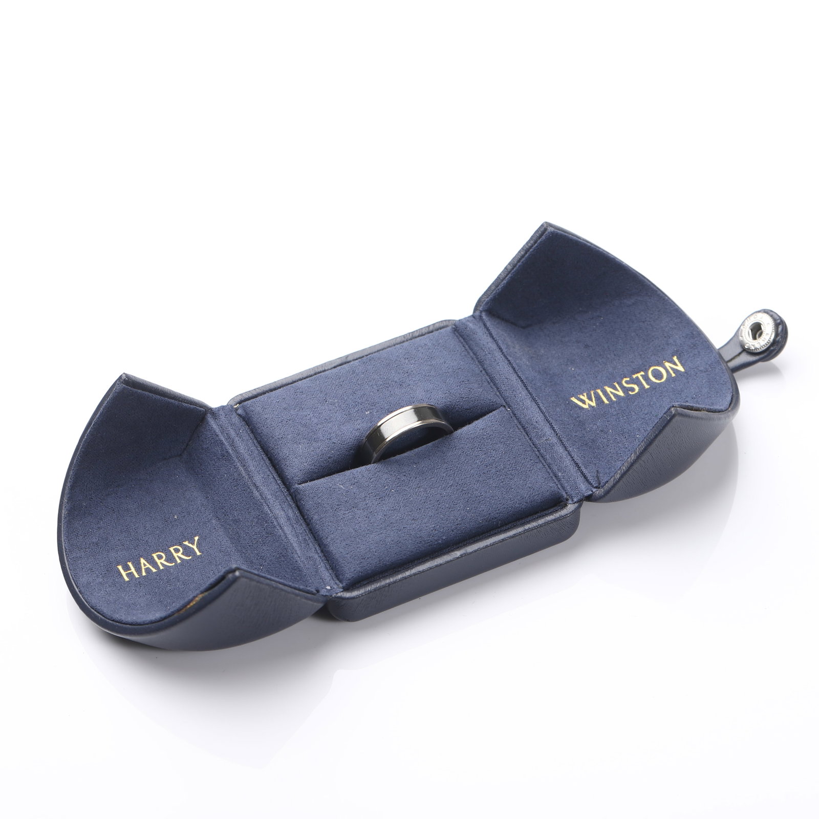 A HARRY WINSTON MEN’S BAND RING, 18K WHITE GOLD AND ZALIUM: Dimensions Inner Diameter: 23/32 in (18.4 mm); Weight: 8.2 g. Description: A refined Harry Winston men’s wedding band crafted from 18K white gold (Au750) and Zalium, a proprietary zirconium-based al