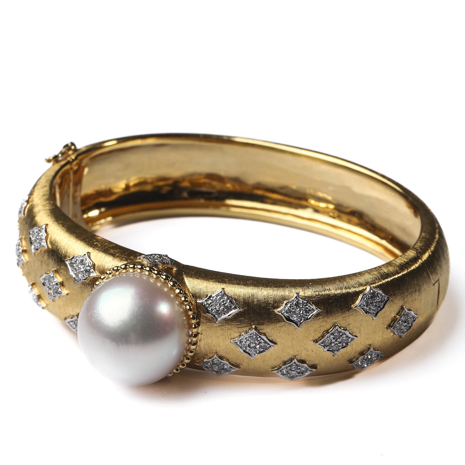 BUCCELLATI-STYLE 18K TWO-TONE GOLD PEARL AND DIAMOND BRACELET: Dimensions Inner diameter 1 7/8–2 1/4 in.(4.7–5.6 cm) suitable for wrists up to approximately 5 7/8 in. (15 cm) weight 66.4g Description The bracelet finely hand-crafted in 18K two-tone gold, feat