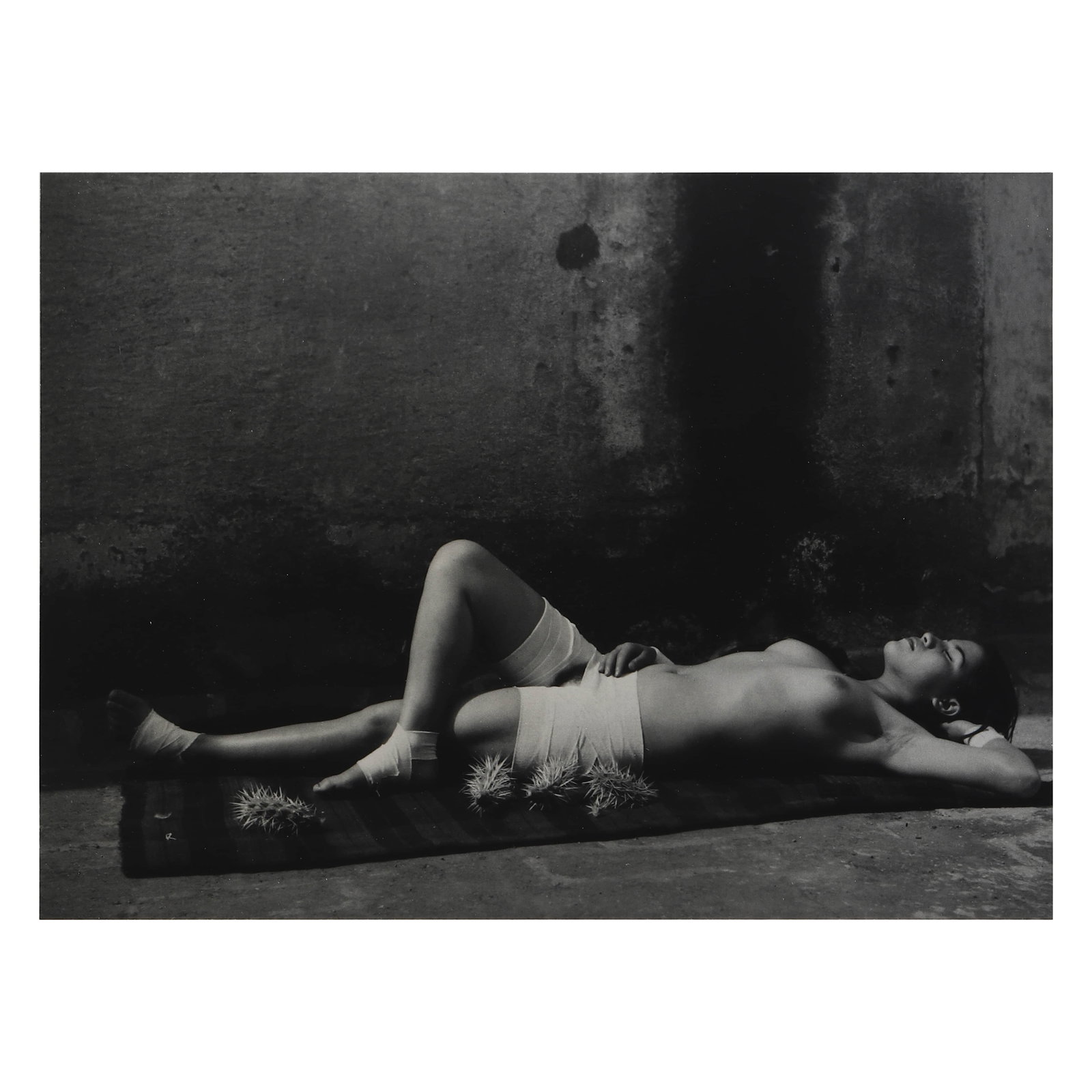 MANUEL ?LVAREZ BRAVO (1902–2002), THE GOOD REPUTATION, SLEEPING: Artist MANUEL ?LVAREZ BRAVO (1902–2002) Title THE GOOD REPUTATION, SLEEPING Medium Silver gelatin print, mounted on board Signature Pencil signed on recto Dimensions Photograph: 7 1/4 × 9 11/16 in.