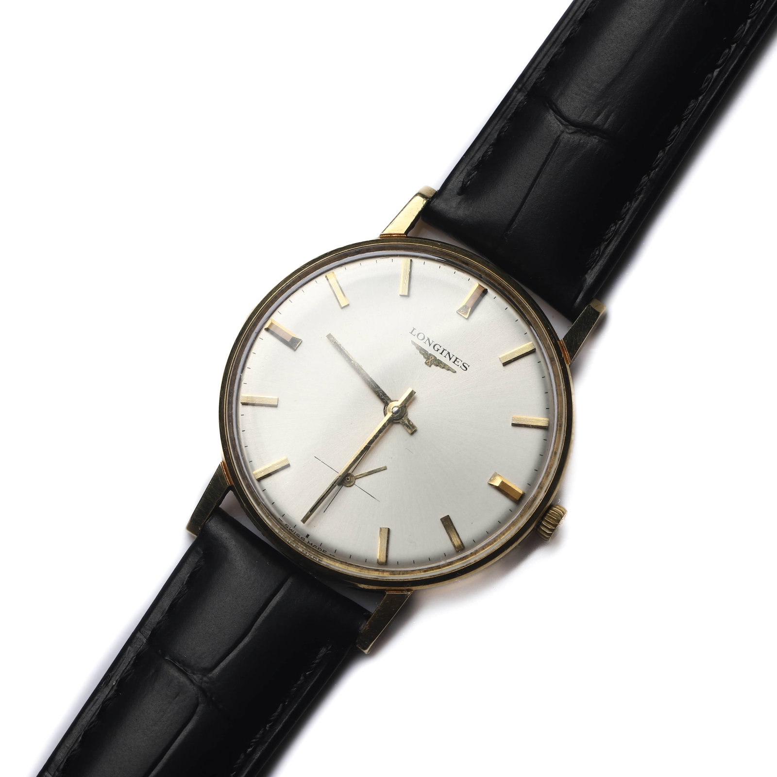 LONGINES MANUAL WIND WRISTWATCH: Dimensions Dial diameter: 1 7/16in (35.7mm); Overall length: 9 1/4in (23.5cm) Description A refined Longines manual wind wristwatch housed in a gold-tone case, featuring a clean silvered dial with app