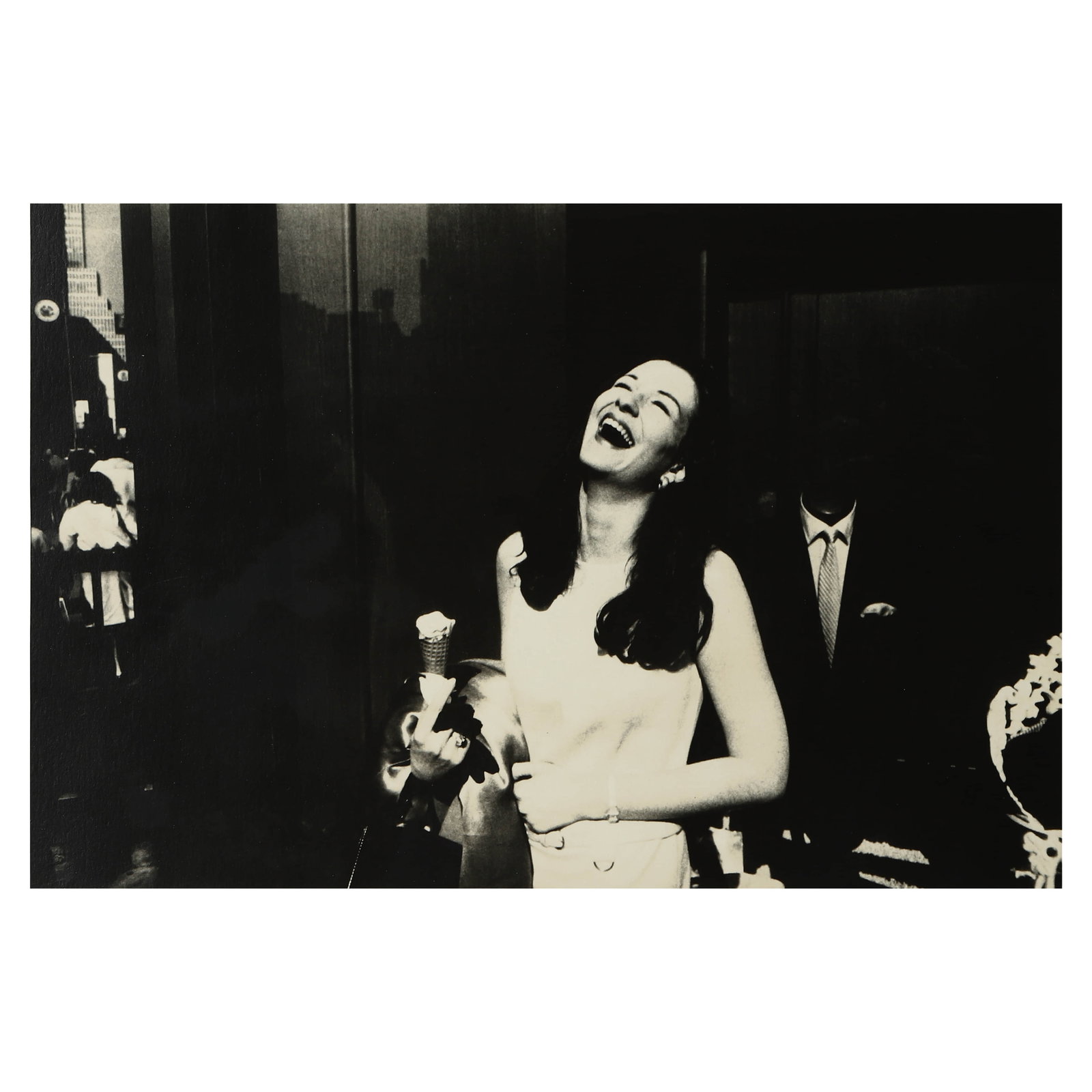 GARRY WINOGRAND (1928-1984) WOMAN WITH ICE CREAM CONE, NEW YORK CITY: Artist GARRY WINOGRAND (1928–1984) Title WOMAN WITH ICE CREAM CONE, NEW YORK CITY Medium Gelatin silver print, mounted on board Signature Signed and stamped on verso Dimensions Photograph: 8 1/2 × 