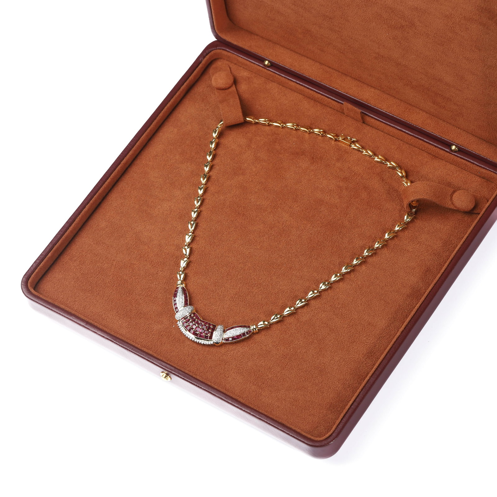 AN 18K TWO-TONE GOLD, RUBY AND DIAMOND NECKLACE: Dimensions Length: 16 15/16 in. (43 cm)Weight: 27.7 g Stones: Ruby approximately 6.5 carats; Diamonds approximately 0.4 carats total Description An elegant necklace crafted in 18K two-tone gold, set w