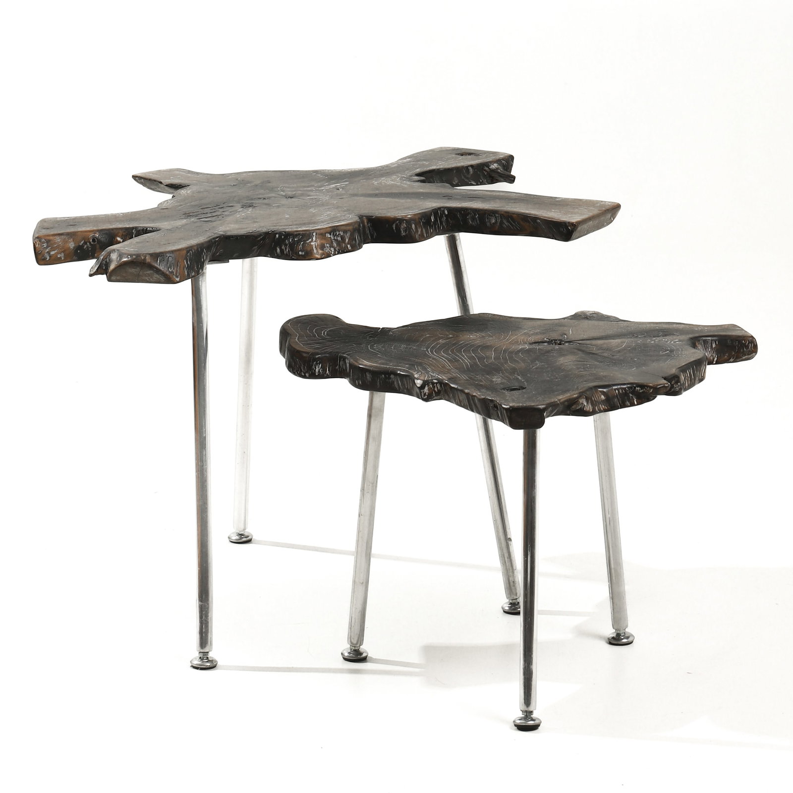 PAIR OF ORGANIC FORM NESTING TABLES: Dimensions 18 7/8 in and 15 in high (48 cm / 38 cm). Description A pair of sculptural nesting tables featuring irregular, free-form tops crafted from natural tree slabs, showcasing expressive grain