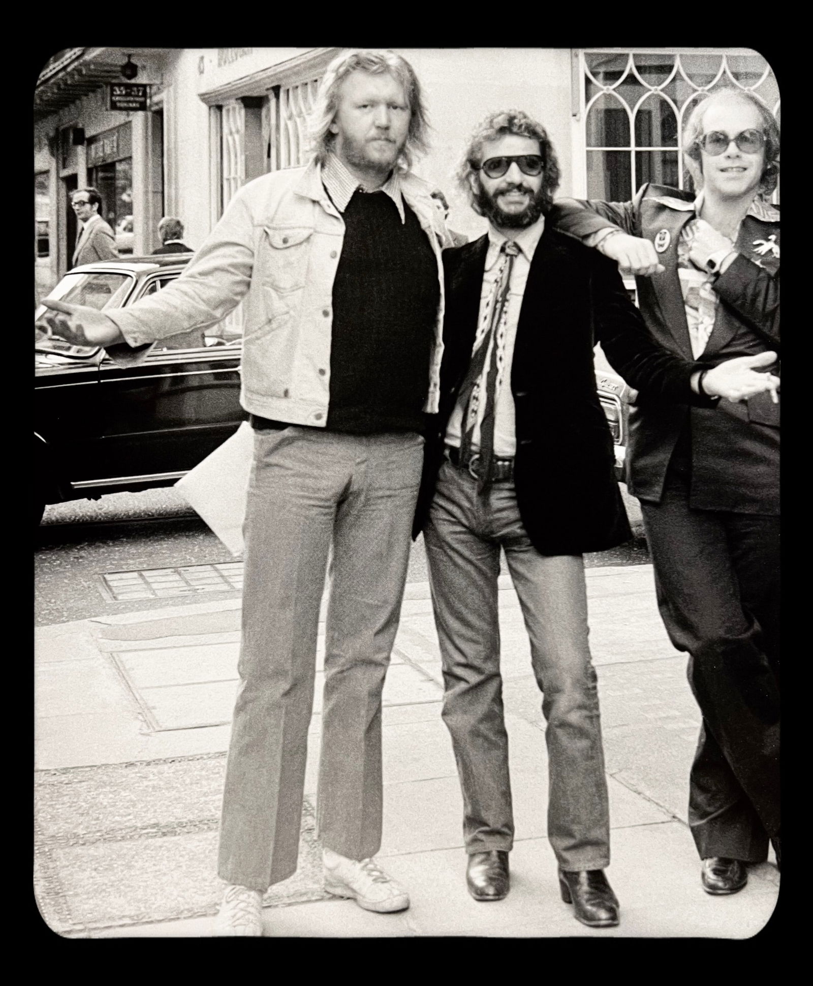 Terry O'neill, Harry Nilsson, Ringo Starr, And Elton John, London, 1975: Photographer: TERRY O'NEILL Subject/Title: Harry Nilsson, Ringo Starr, And Elton John, London Date Of Negative: 1975 Type Of Print: Authentic Sheet Fed Photogravure/Heliogravure. Date Of Print: 2020 P