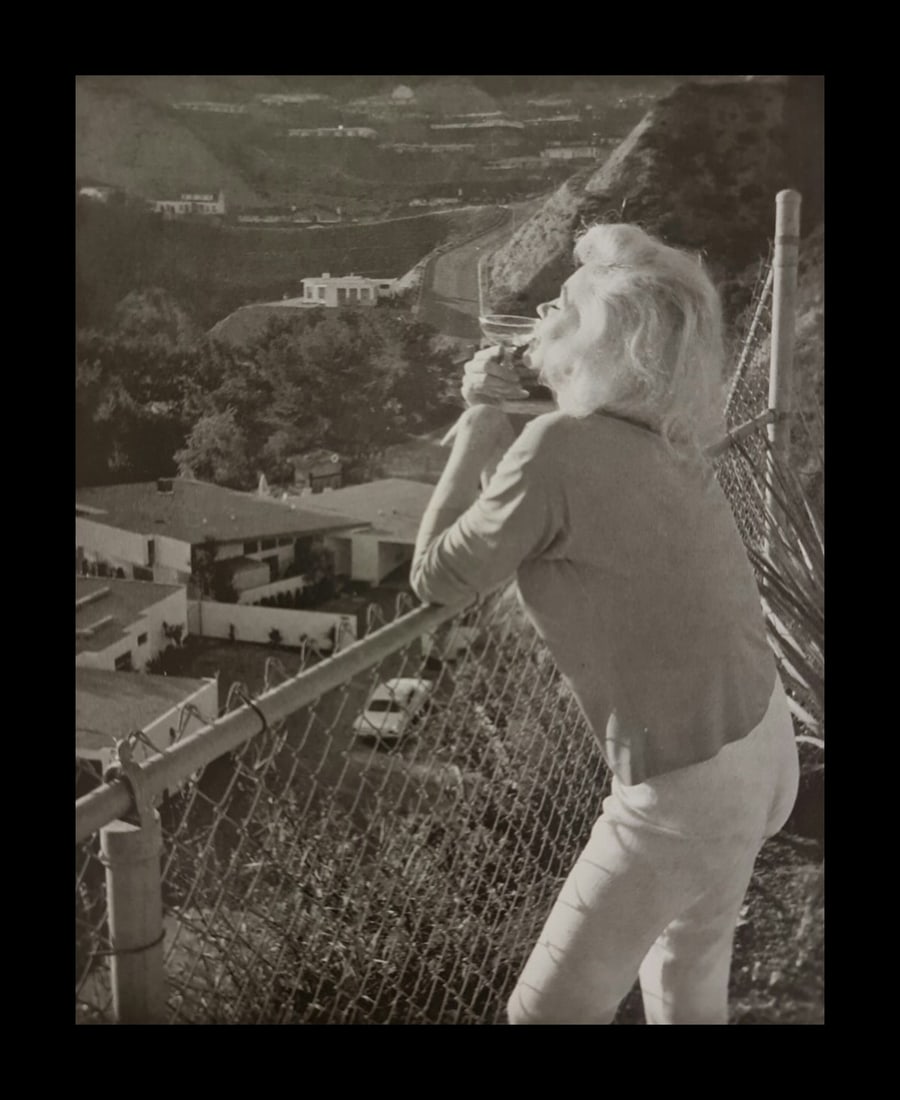 Marilyn Monroe enjoying a cocktail: Photographer: George Barris Subject/Title: Marilyn Monroe enjoying a cocktail Date Of Negative: Undated Type Of Print: Authentic Vintage Sheet Fed Photogravure/Heliogravure Date Of Print: 2000 Publish