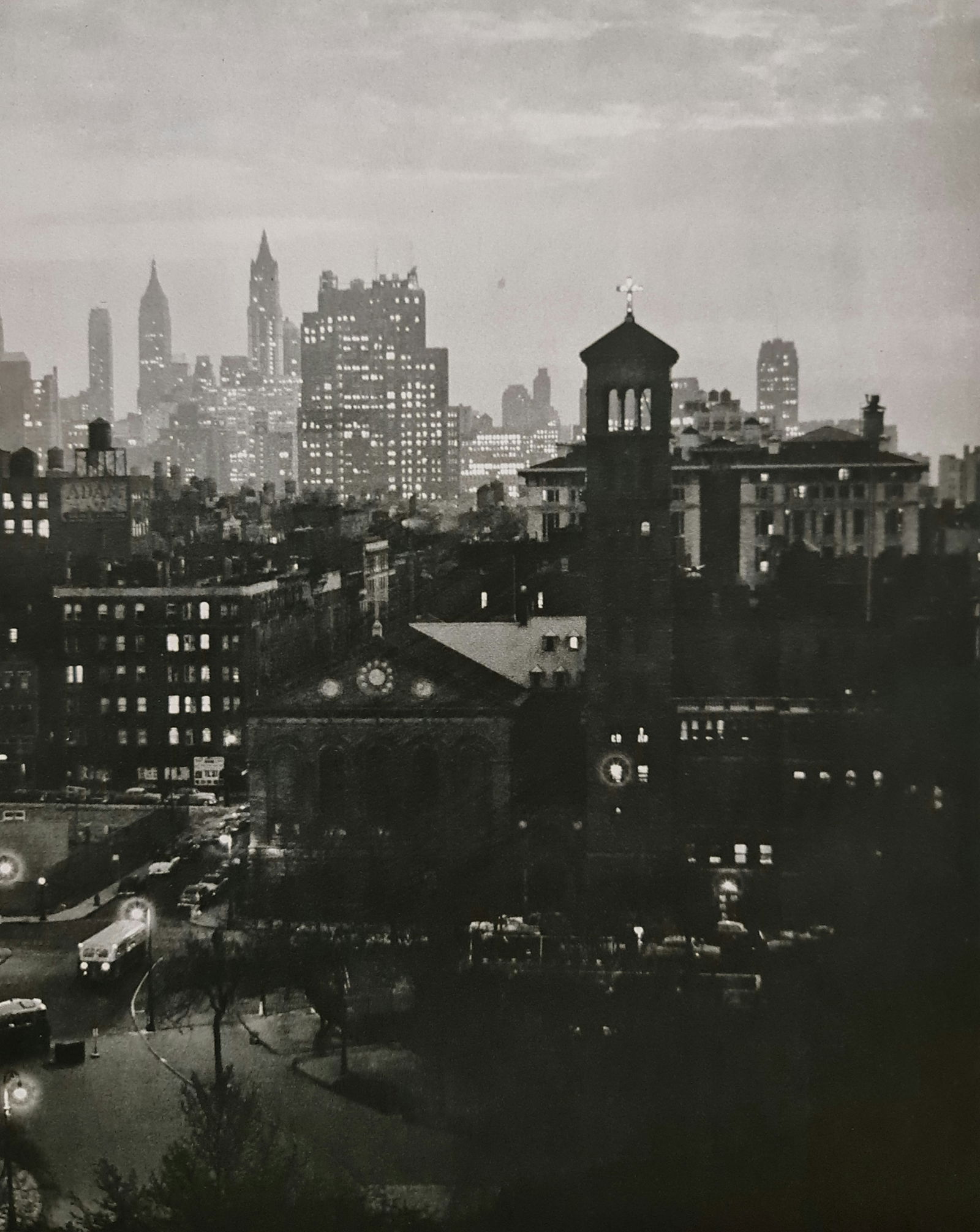 André Kertész, Evening view, New York, date unknown: Photographer: André Kertész, born Andor Kertész, was a Hungarian-born photographer known for his groundbreaking contributions to photographic composition and the photo essay. Subject: Evening view,