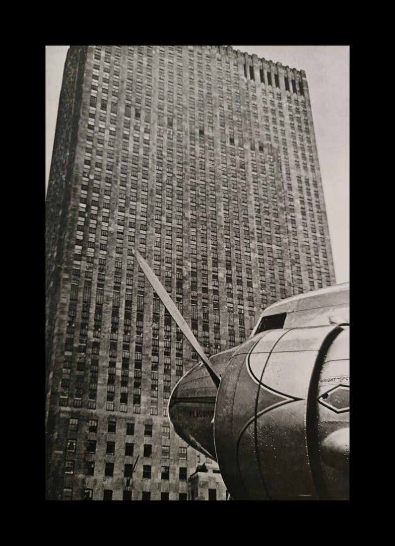 André Kertész, Airplane and building, New York, 1939: Photographer: André Kertész, born Andor Kertész, was a Hungarian-born photographer known for his groundbreaking contributions to photographic composition and the photo essay. Subject: Airplane and