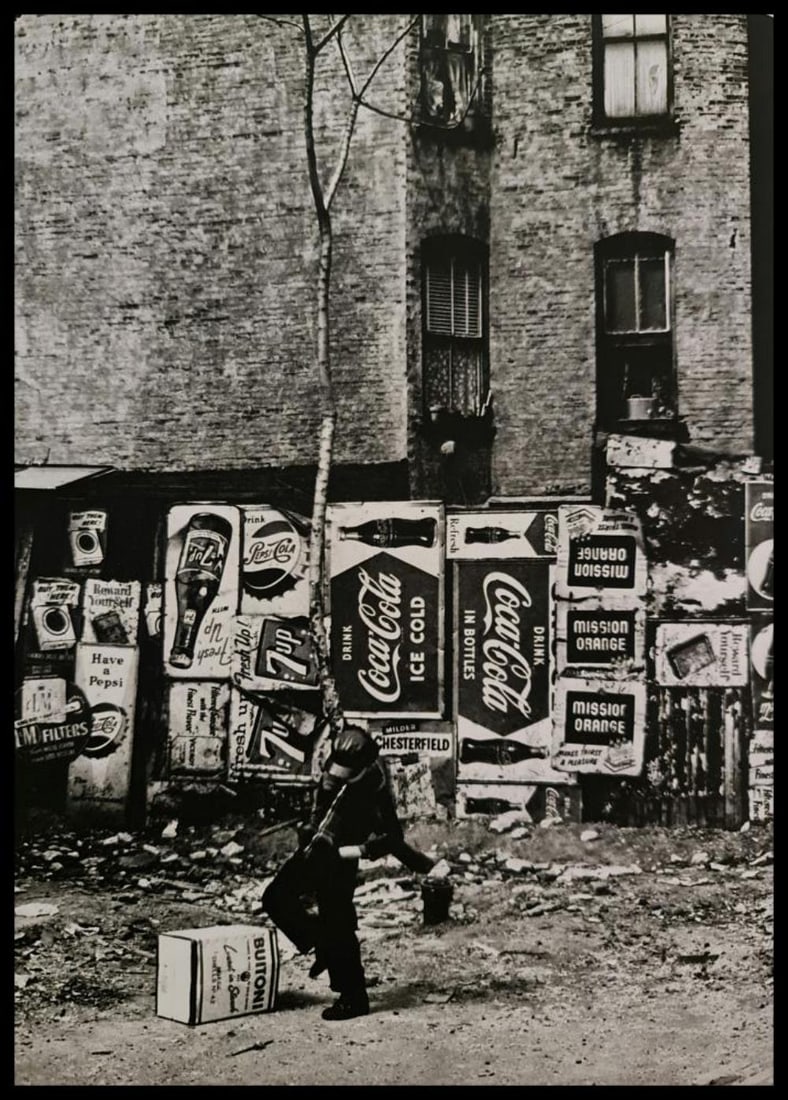 André Kertész, Boy in dirty street,New York, 1959: Photographer: André Kertész, born Andor Kertész, was a Hungarian-born photographer known for his groundbreaking contributions to photographic composition and the photo essay. Subject: Boy in dirty