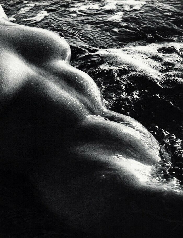 Lucien Clergue, Female Nude Beach Wet Body, 1960s: Photographer: Lucien Clergue (France, 1934 - 2014) - renowned French photographer with a diverse body of work, he is perhaps best known for his dynamic female nude studies in and around water which of