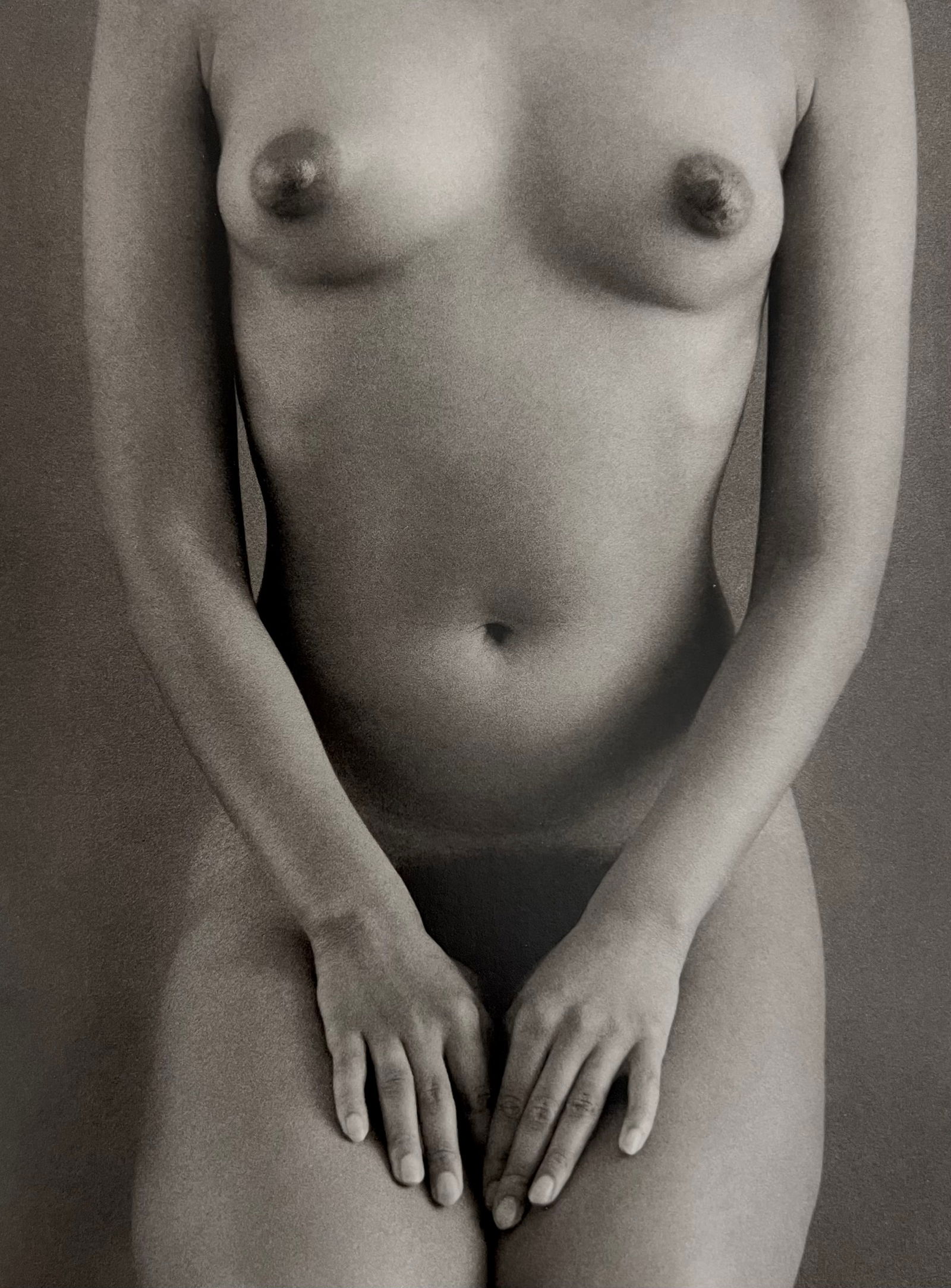 Ruth Bernhard, Dark Torso With Hands, 1971: Ruth Bernhard (1905-2006) was the daughter of Lucien Bernhard, a graphic designer known as "the father of the German poster." After studying for two years at the Berlin Academy of Art, she came to New