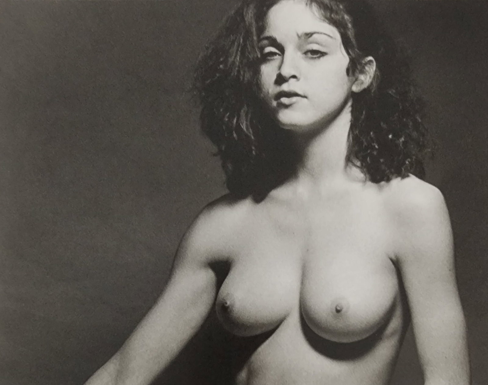 Madonna 21 Years old, Nude photo shoot, 1979 by Martin Schreiber: Artist/Photographer: Martin SchreiberTitle/Subject: Madonna Nude, 1979 Condition: Extra Fine - Excellent Type Of Print: Authentic Sheet Fed Photogravure/Heliogravure Paper: Medium weight, satin/matte 