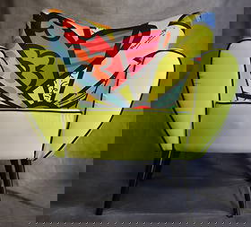 Romero Britto Limited Edition Pop Art Accent Arm Chair: Artist: Romero Britto Medium: Upholstered designer chair with printed fabric Dimensions: Approx. 37"(H)x35"(W)x28"(D) Condition: Excellent — original hangtag attached Type: Art Arm Chair Tag Informa