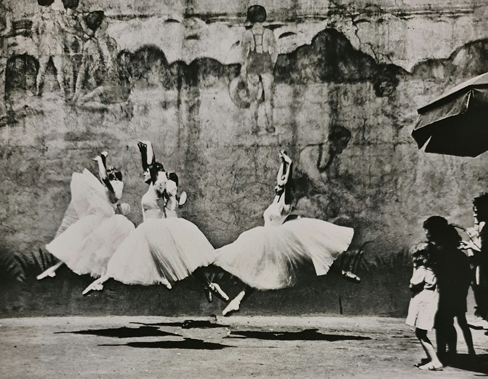 André Kertész, Dancers, New York, 1938: Photographer: André Kertész, born Andor Kertész, was a Hungarian-born photographer known for his groundbreaking contributions to photographic composition and the photo essay. Subject: Dancers, New