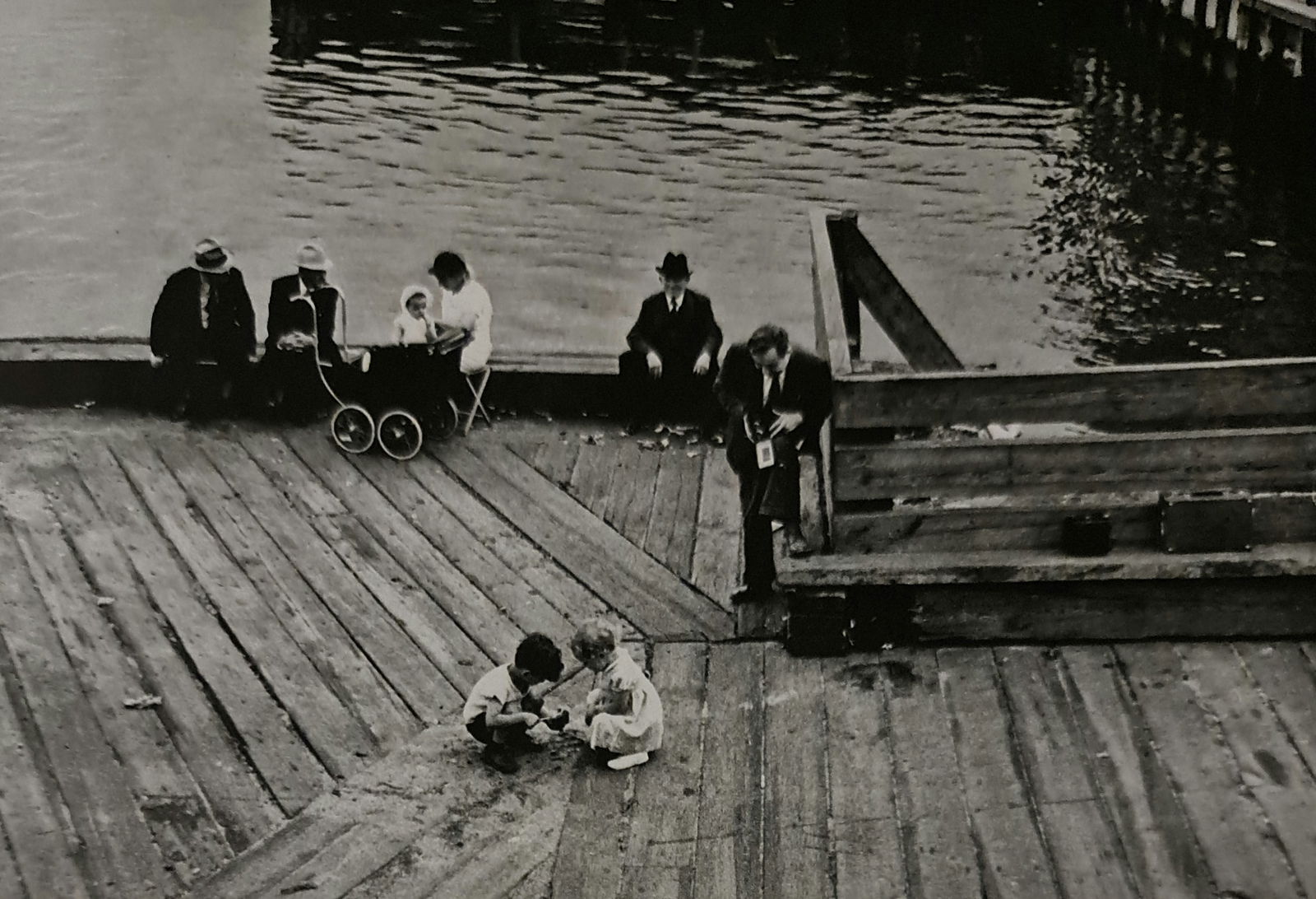 André Kertész, Enjoying the dock, New York, 1938: Photographer: André Kertész, born Andor Kertész, was a Hungarian-born photographer known for his groundbreaking contributions to photographic composition and the photo essay. Subject: Enjoying the