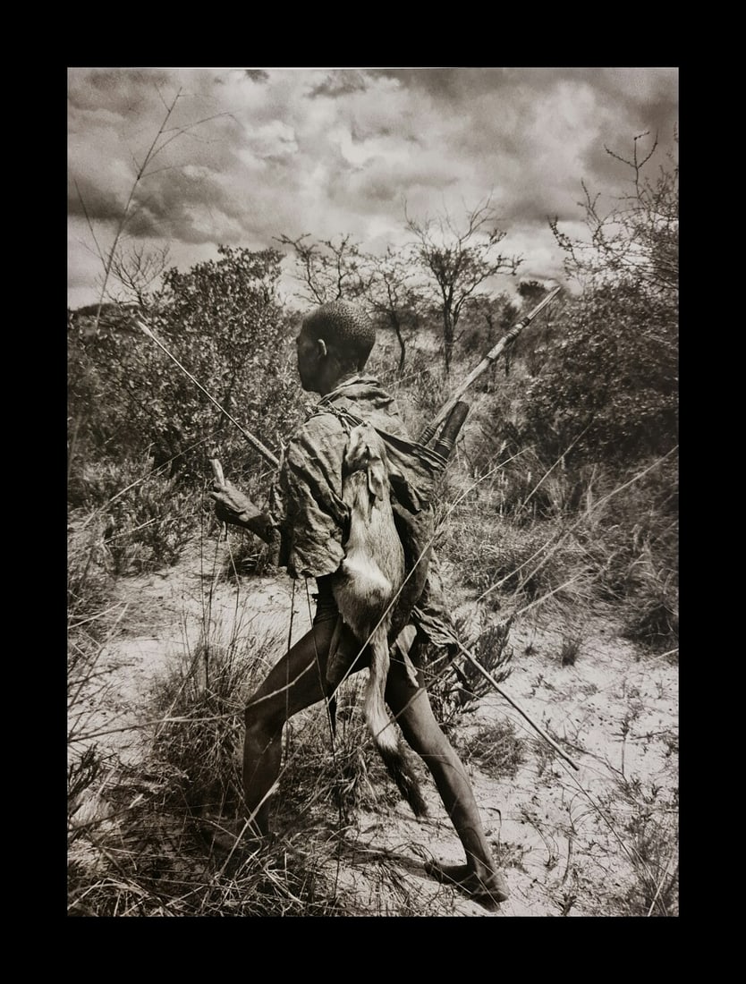Sebastian Salgado, A hunter carrying a native hare, Botswana, 2008 (1 of 1)