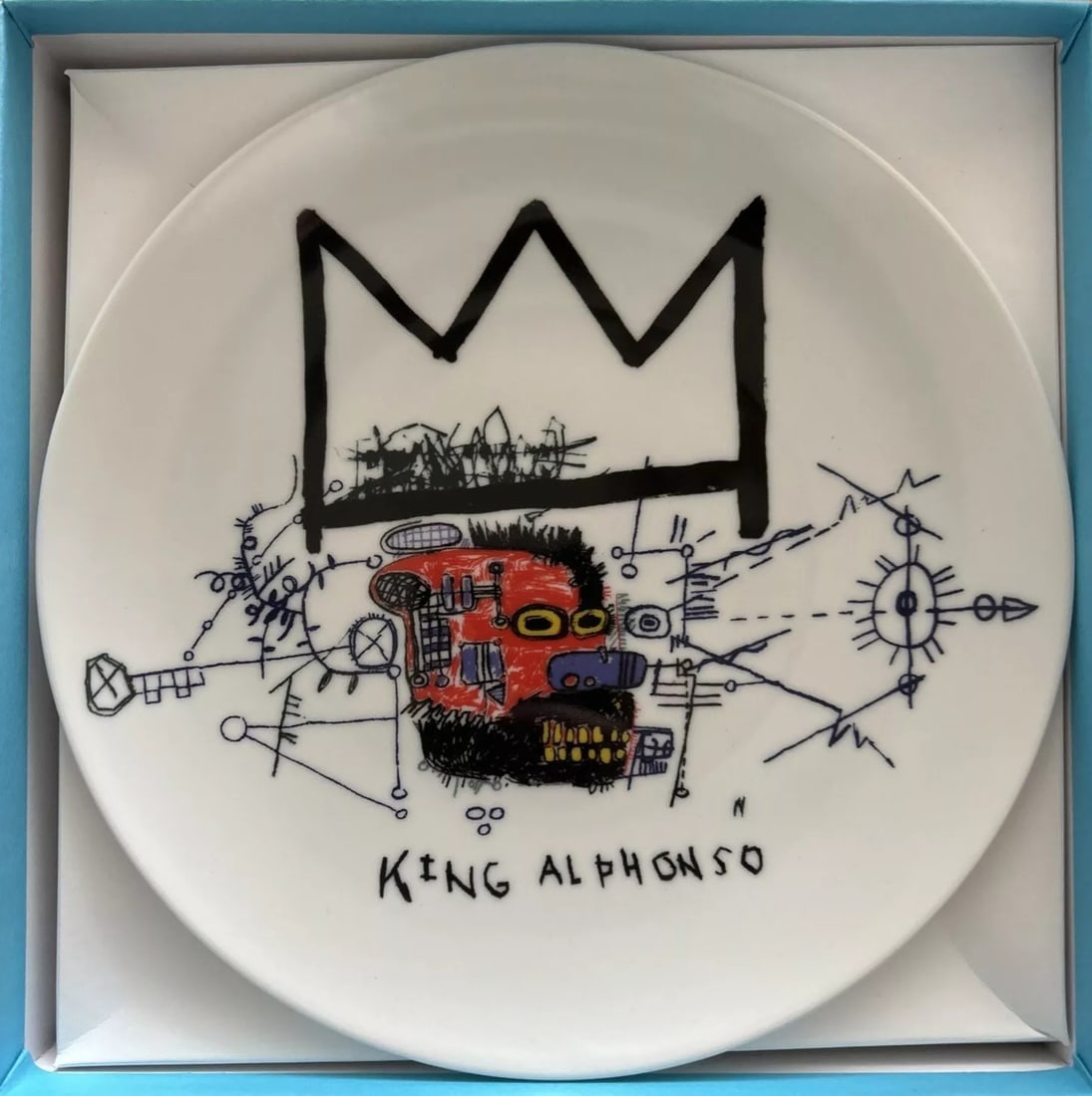 Jean Michel Basquiat Porcelain Plate # 1 Licensed and Made in France: Jean Michel Basquiat Licensed Porcelain Plate By Ligne Blanche Made in France Licensed By Artestar, New York the Estate of Jean Michel Basquiat Condition- Excellent and comes with original box Artist 