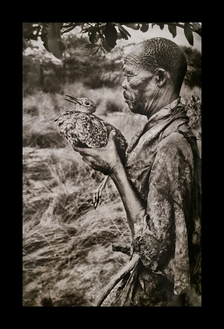 Sebastiao Salgado, Hunter holding a korhaan, Botswana, 2008 (1 of 1)