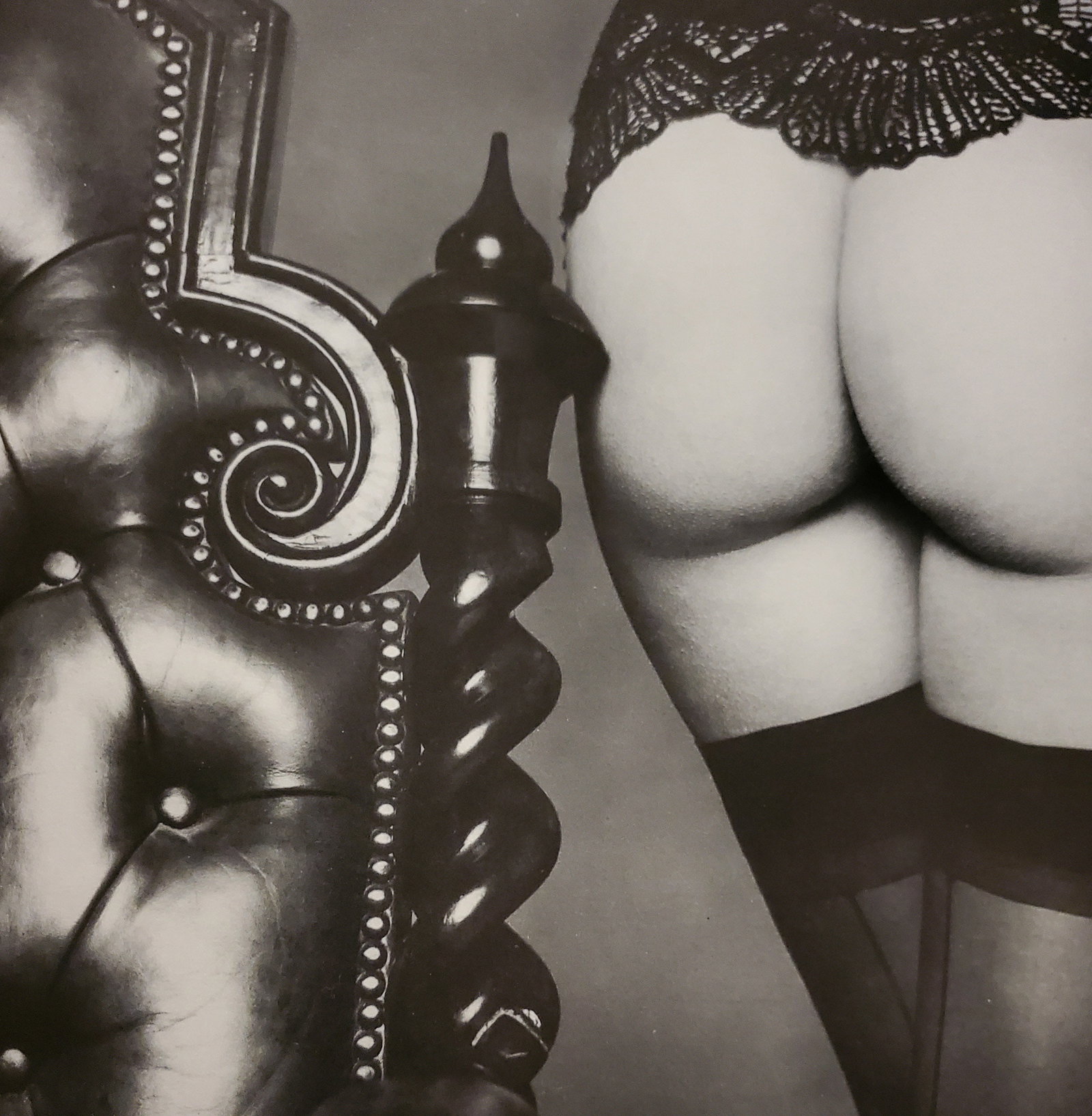 John Swannell, Butt by the Bedpost, 1980's: Photographer: John Swannell was born in 1946. After leaving school at 16, he worked first as an assistant at Vogue Studios and then assisted David Bailey for four years before setting up his own
