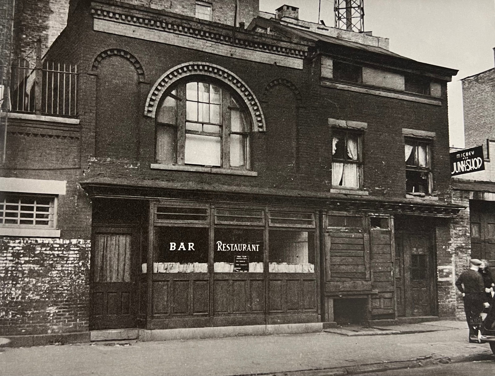 Berenice Abbott, West 18th Street, Nos. 461-463, 1930s: Photographer: Berenice Alice Abbott was an American photographer best known for her portraits of between-the-wars 20th century cultural figures, New York City photographs of architecture and urban des