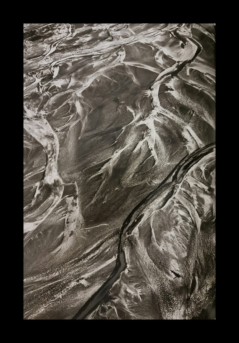 Sebastian Salgado, Dusty River, Kluane National Park, Canada, 2011: Photographer: Sebastiao Ribeiro Salgado Junior is a Brazilian social documentary photographer and photojournalist. He has traveled to over 120 countries for his photographic projects. Most of these ha
