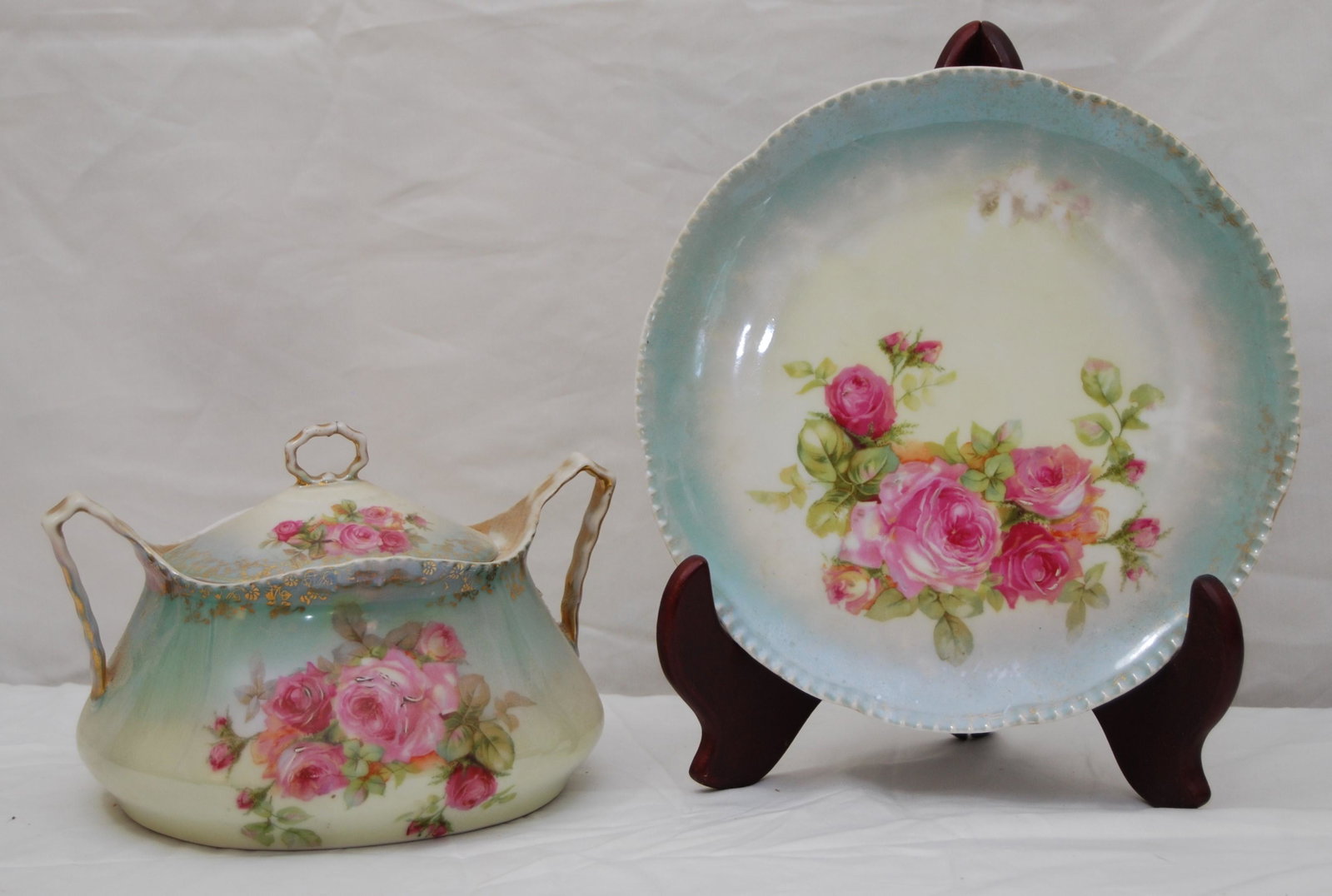 Vintage Royal Rudolstadt Biscuit Jar with Plate: Vintage Royal Rudolstadt Biscuit Jar with Lid & Royal Rudolstadt Plate. Includes biscuit jar and lid with hand painted roses with gold gilt - 5”t x 8”w. Plate has scalloped edge and is han