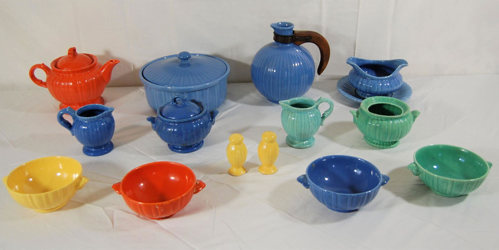 Stangl Art Pottery Set-Multi-Colored Large Lot: Multi-Colored Stangl Art Pottery Set. Large lot of lovely pieces of many colors including: covered serving dish, gravy boat, tea pot, creamer and sugar, salt and pepper. Two platters. Two vegetable di