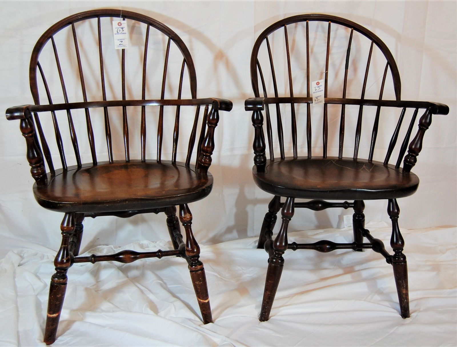 Two - Vintage Bow Back Arm Chairs: Two - Bow Back Arm Chairs. Made by Nichols and Stone, mid 1900's. The chairs are labeled "Nichols and Stone All American" carved under the seat. 35"h x 25"w.