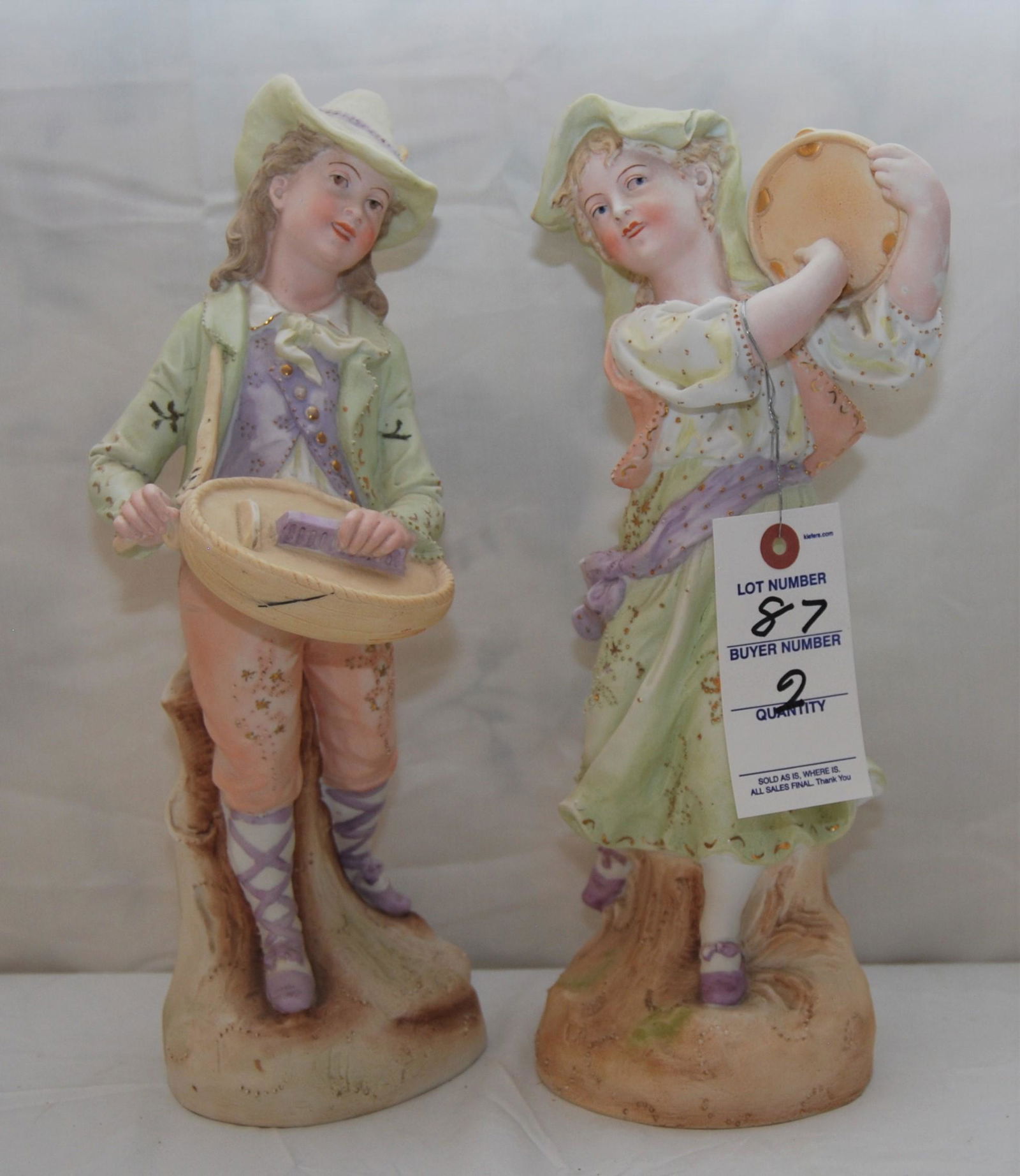 Vintage Handpainted Bisque Musicians-2 figures: Vintage Handpainted Bisque Musician Figurines - Male & Female. Likely German-made. Handpainted with gold gilt. The pair depicts a Renaissance-era couple with the male playing a hurdy-gurdy - the femal