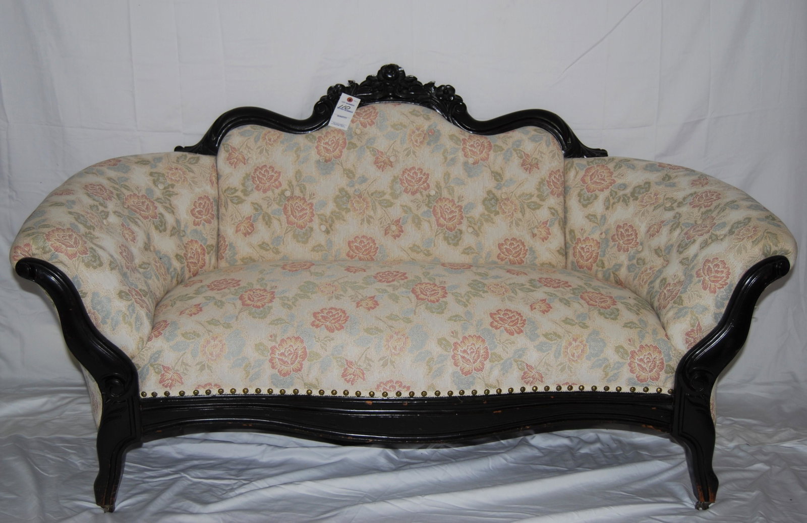 Victorian Settee-mid 1800s: Victorian Settee. Original brass and wood casters. Very good condition and its been reupholstered. Mid 1800's. 33"h x 61"w x 26"d.