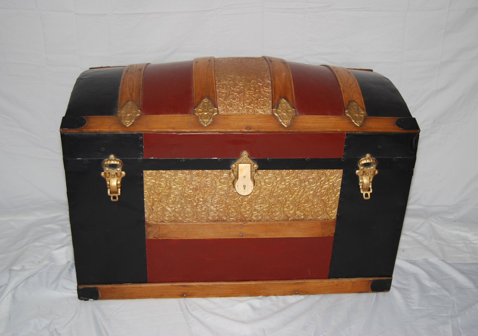 Antique Domed Top Travel Trunk-late 1800s: Antique Domed Top Travel Trunk. Tin covered exterior with wood bands, leather straps and original roller feet. Interior has lift-out shelf and has been fully relined in fabric. This piece is nicely re