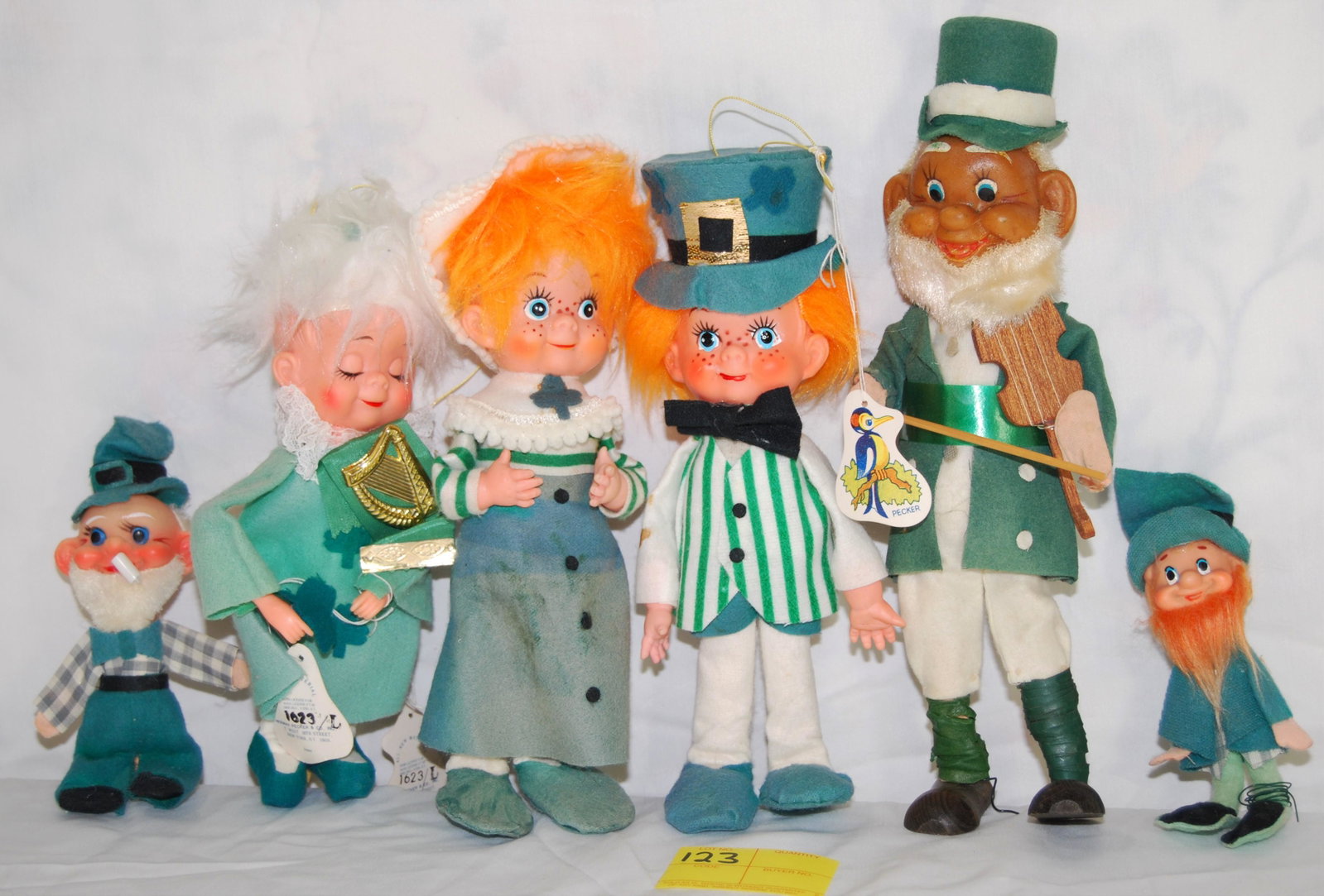 Herman Pecker Collectible Irish Dolls-6 dolls: Herman Pecker Collectible Irish Dolls. Includes 6 dolls. All depict Irish characters, including a black fiddle player. Three have paper tags with the woodpecker “Pecker” on one side, the r