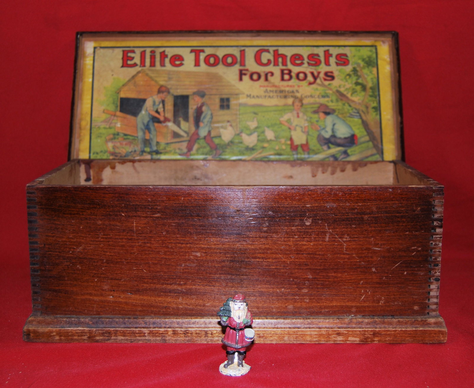 Antique Toy Tool Box + 1800s Lead Santa Figure: Antique Wood Toy Tool Box & 1800s Lead Santa Claus Figurine. Toy Tool Box is in pine with a hinged lid and machine dovetailing, marked “Elite Tool Chests for Boys manufactured by American Manufa