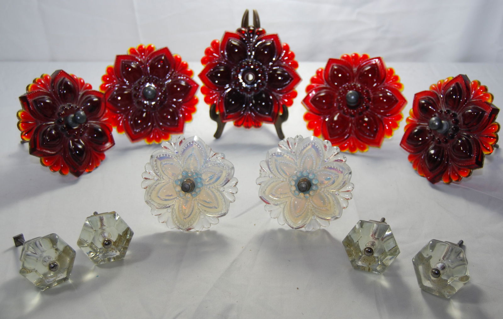 Sandwich Glass Curtain Tie backs & more-11 items: Vintage Sandwich Glass Curtain Tie Backs & other Tie Backs. This lot of 11 items includes: six 4 1/2"w Sandwich ruby-red tie-backs in the floral pattern, with one tiny hard-to-see chip on one of the t