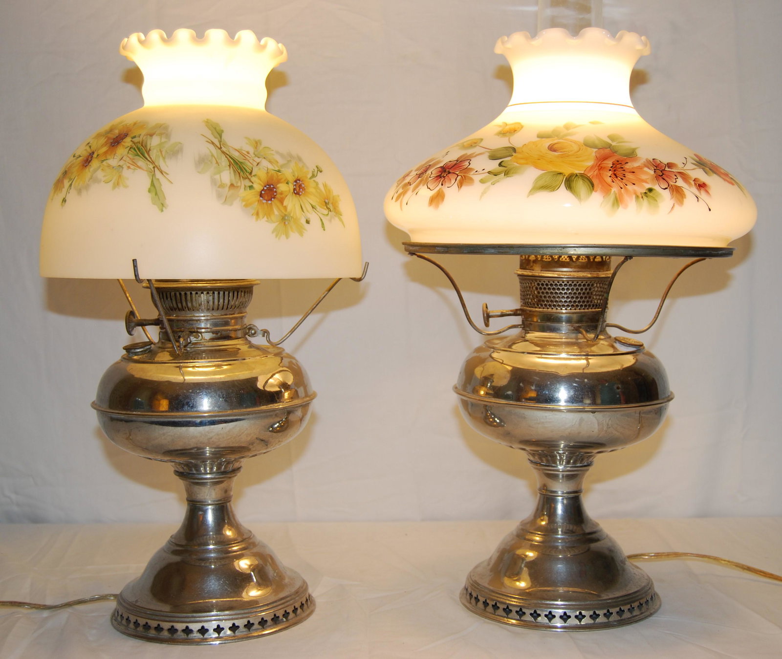 2 - Vintage Rayo Electric Oil Lamps-nice shades: Antique Rayo Nickel Plated Converted Electric Oil Lamps. Early 1900's. One has handpainted Milk Glass shade and is 21"h to the top of chimney. One has handpainted Frosted Glass shade and is 18"h. Some