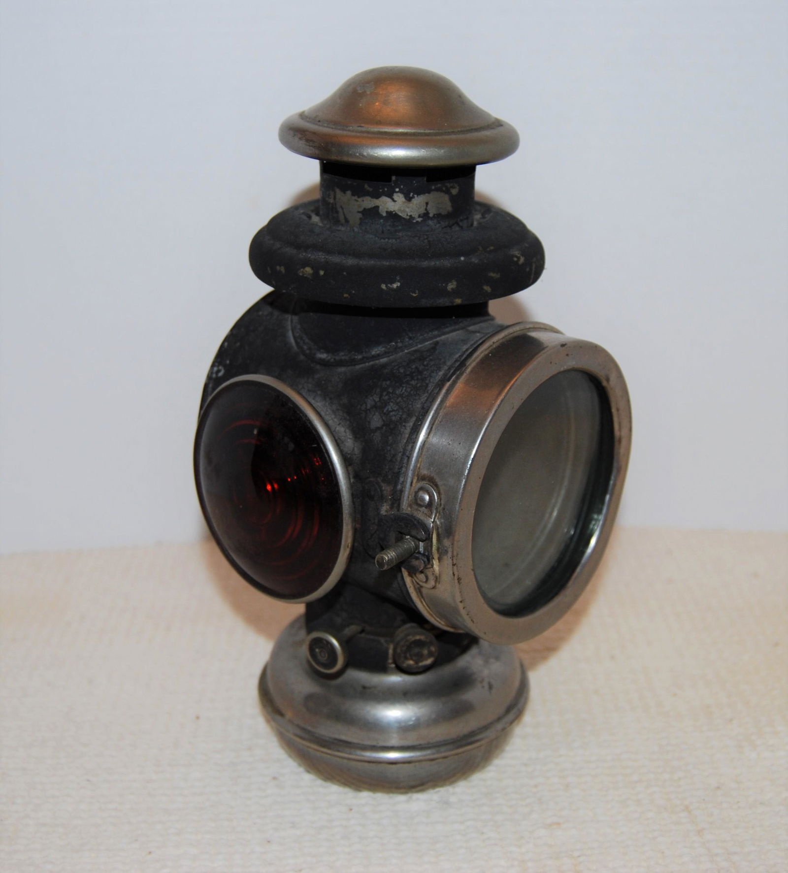 1800s Railroad Caboose or Coach Lantern: 1800’s Coach/Car or Railroad Caboose Oil Lantern with Side Mount Bracket. The lantern has a clear lens on swivel door in the front and a red lens on the side. Good condition with a nice patina that