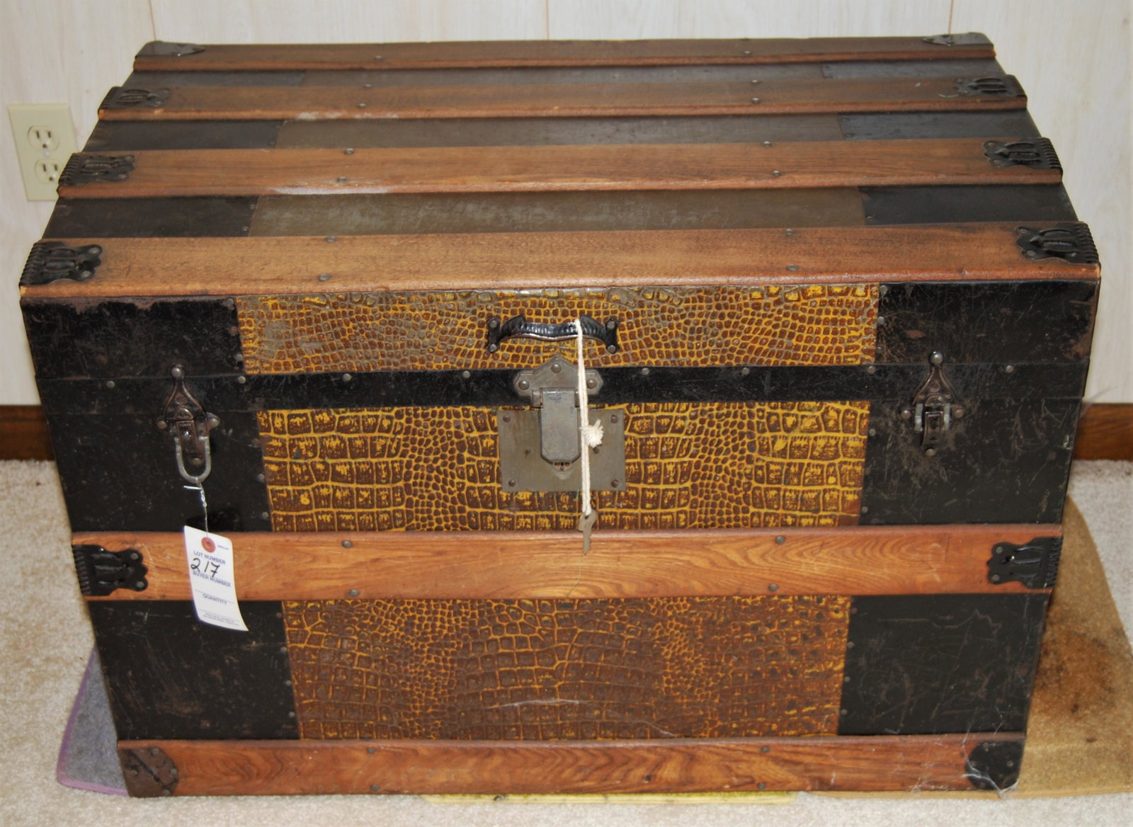Antique 19th Cent. Travel Trunk-from Mass.: Antique 19th Century Travel Trunk Made in Massachusetts. Exterior is tin covered in a pressed alligator pattern, with wood bands, leather straps (one strap is split) and original roller feet. Interior