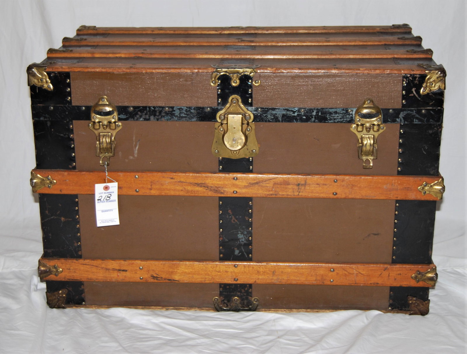 Vintage New York-made Travel Trunk-1800s: Vintage New York-made Travel Trunk. 1800's. Exterior is canvas covered with tin corners and wood bands, leather handles, and original roller feet. Interior has lift out drawer with cover and original 