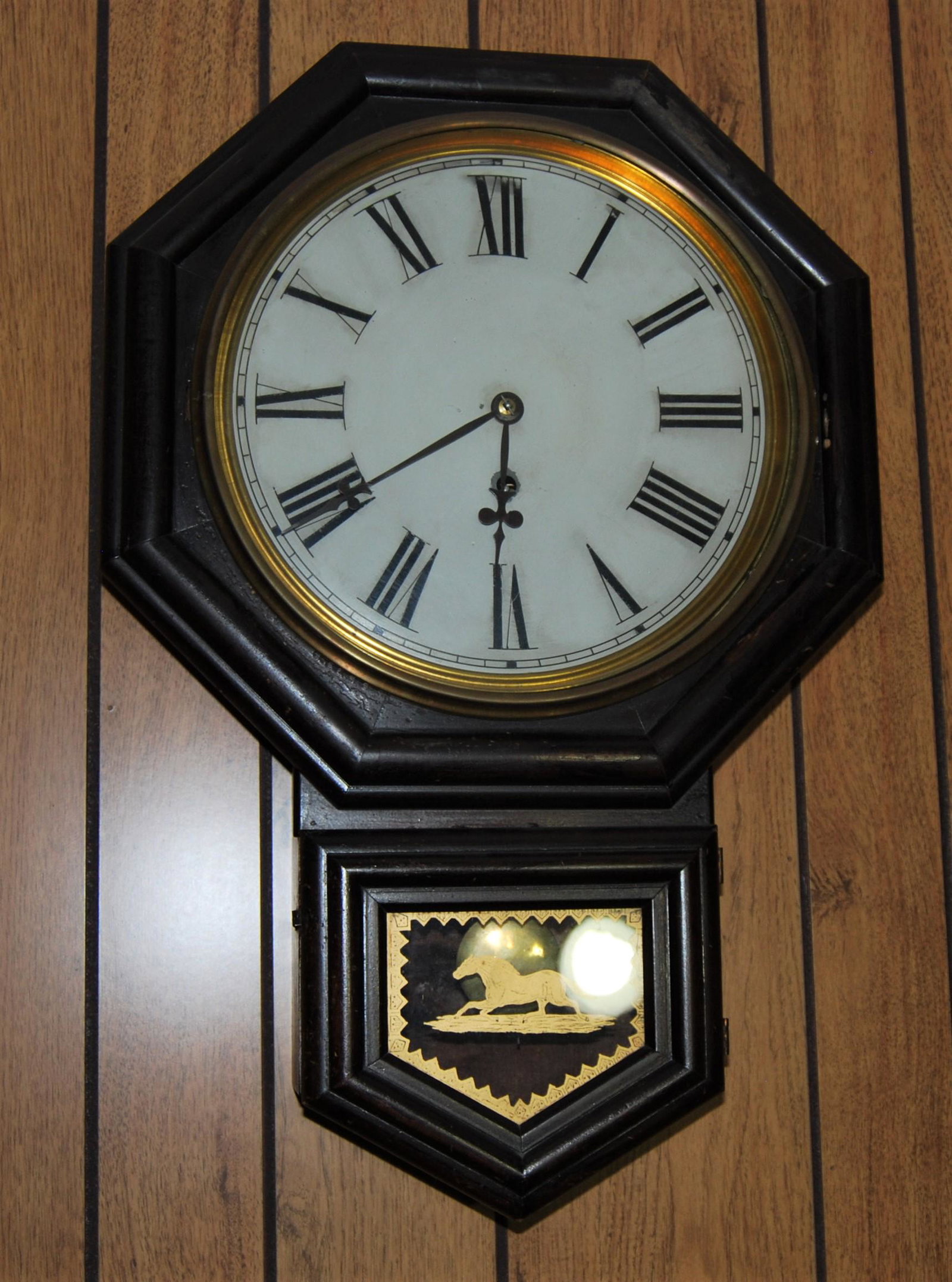 E. N. Welch Regulator Clock, Axtell model: E. N. Welch Regulator Clock, Axtell model. Paper label on back reads "12 inch Axtell Manufactured by the E.N. Welch Mfg. Co. Forestville, Conn. USA". 25"h x 16 1/2"w. Clock face is 12"w.