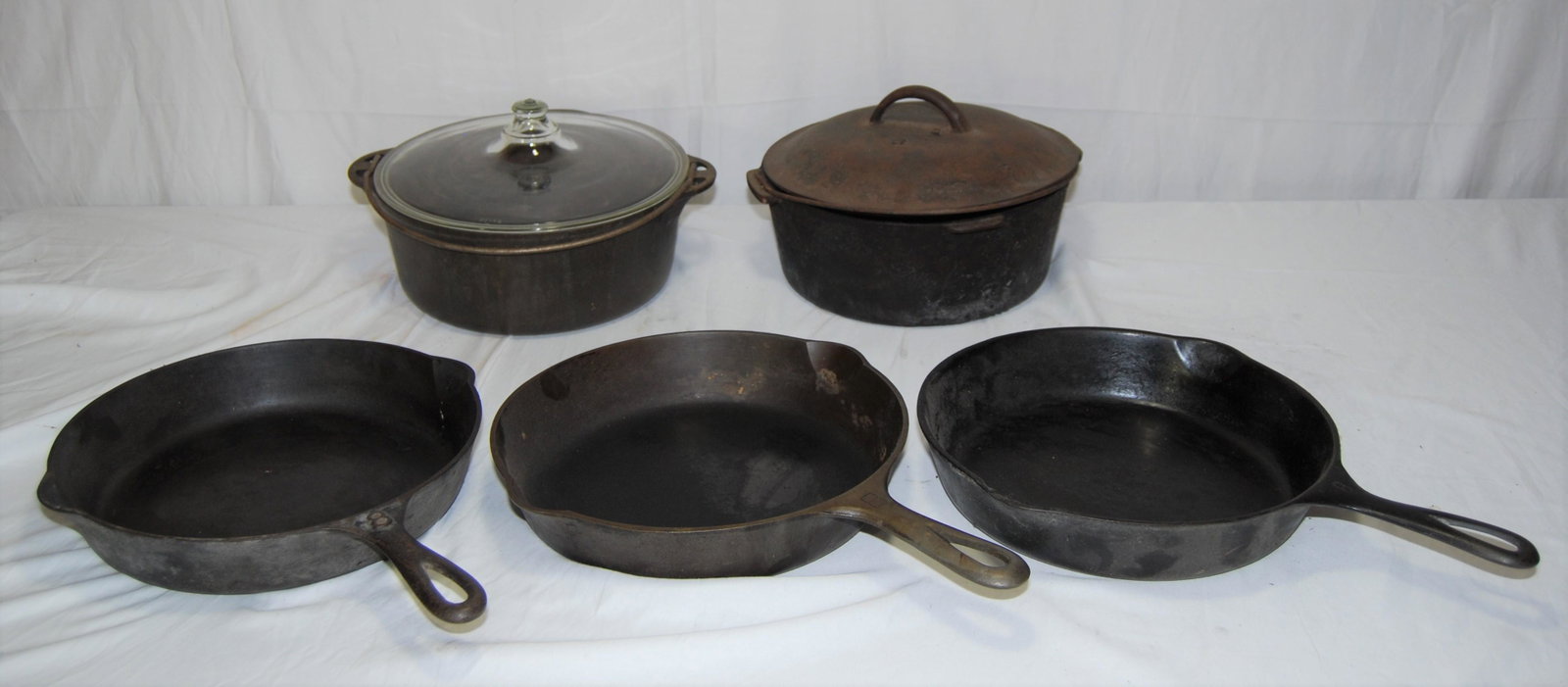 Vintage Cast Iron Cookware-Griswold-Wagner-more: Antique Cast Iron Cookware. Lot of 5 items includes: Griswold frying pan # 8, also - Wagner Ware Sidney frying pan “-0-“ “1058Y”, also – Lodge, also – Griswold R