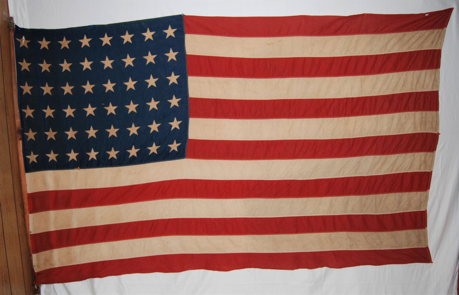 Vintage Early 1900’s 48 Star American Flag: Vintage Early 1900’s 48 Star American Flag. Large cotton flag. Fair condition as it shows some wear and soiling from flying. 90”w x 56”h.