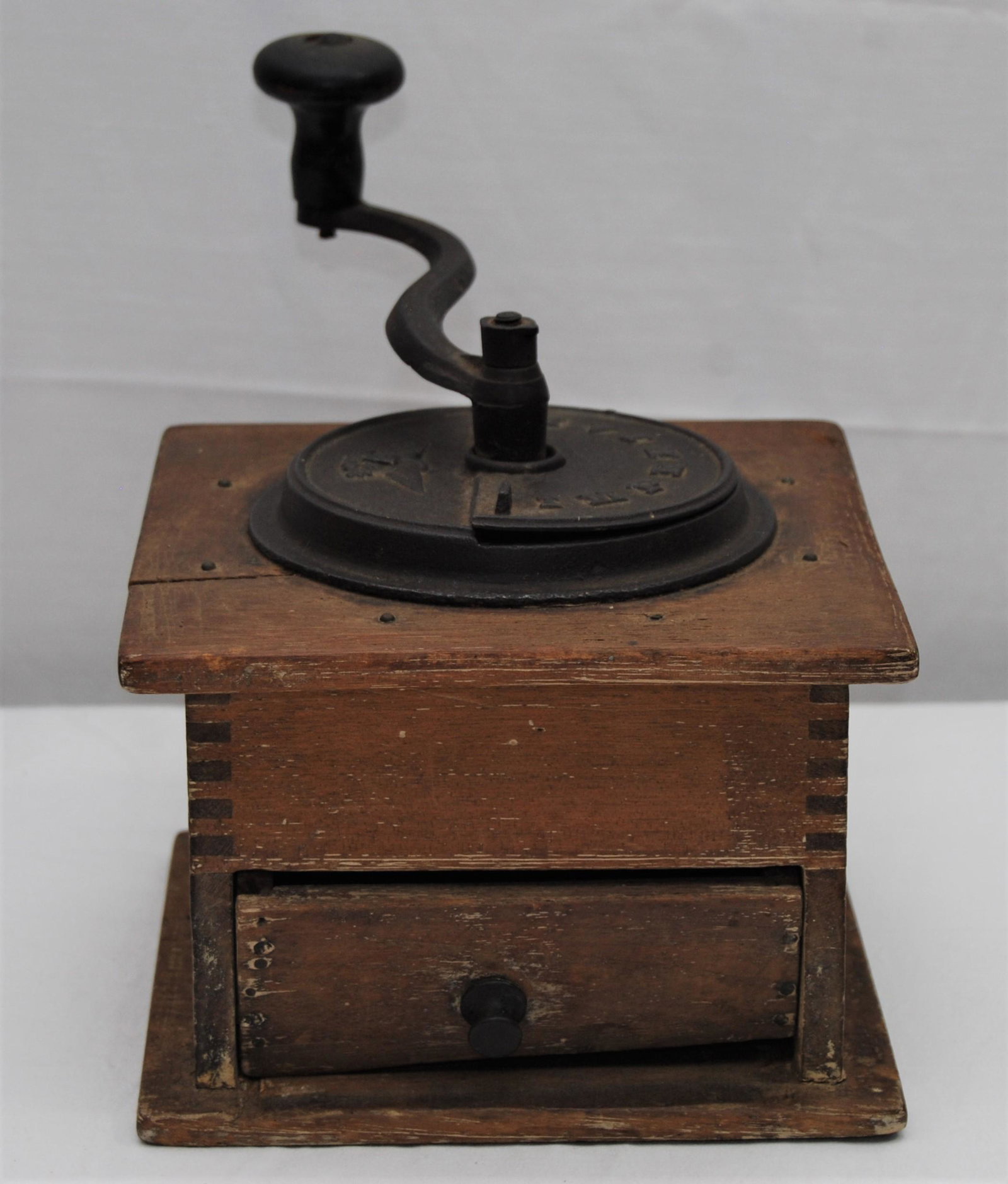 Antique Imperial Coffee Grinder: Antique Imperial Coffee Grinder. The grinder cranks & has working drawer. The wood case is somewhat faded with age, has a small repair, and shows signs of age.