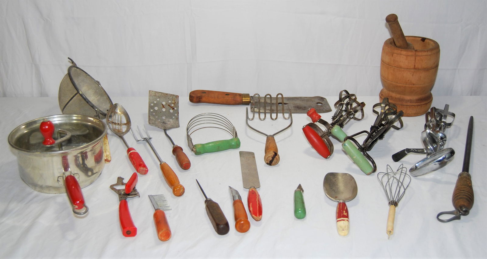 Vintage Kitchen Tools-many wood handled-21 items: Antique & Vintage Kitchen Tools - many are Wood Handled. Lot of 21 items includes: antique wood mortar & pestle, 8” meat cleaver dated “1895”, food mill, knife sharpener, hand mixers