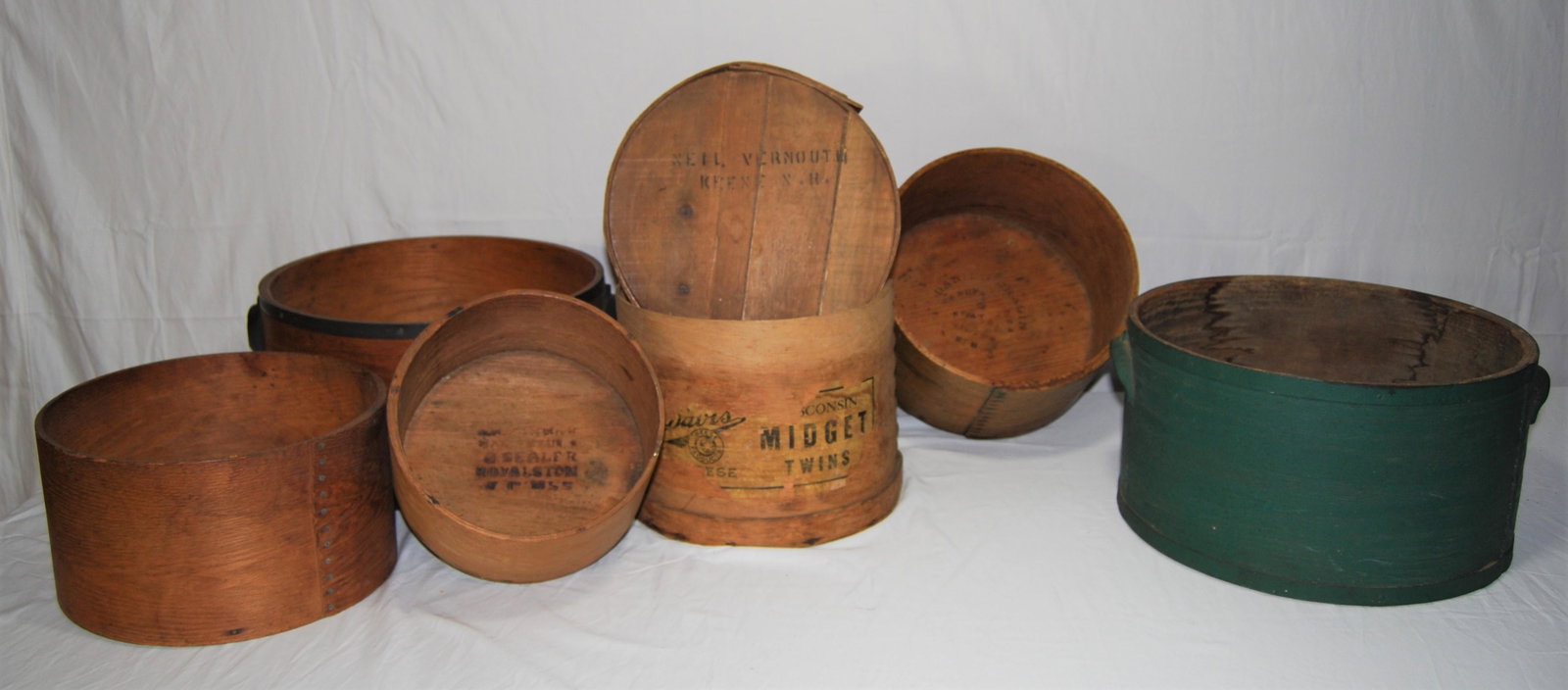 Antique New England Cheese Boxes-6 boxes - NICE: Antique New England Cheese Boxes, several in Oak. Lot of 6 items including a green painted box with metal bands. Also, a natural wood oak box with metal bands marked “S.M. Farrar Manufacturer an