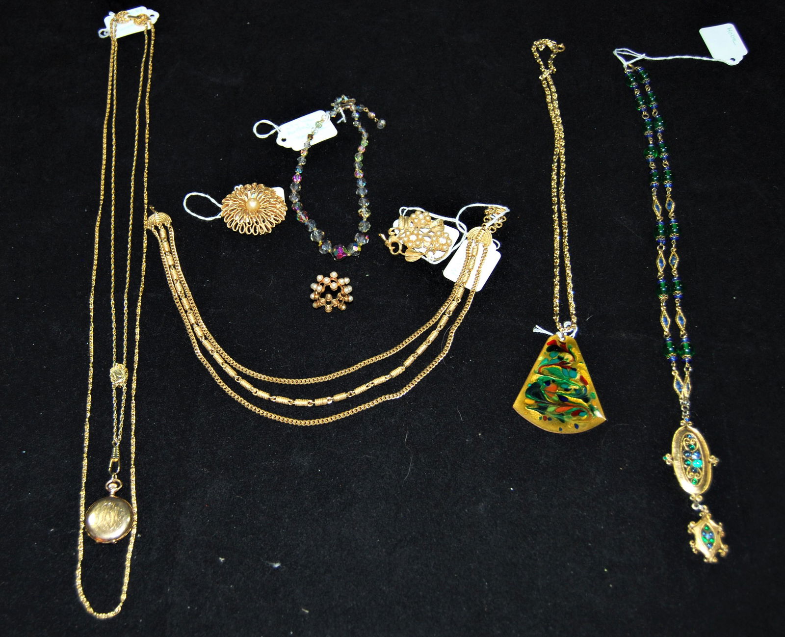 Vintage Costume Jewelry-Monet-Trifari-Hobe-more: Eclectic Vintage Costume Jewelry by Monet, Trifari, Donald Kendrick of Worcester, MA and others. Lot of 8 items including a Goldette NY pendant watch, Laguna Aurora Borealis necklace, Hobe pendant nec