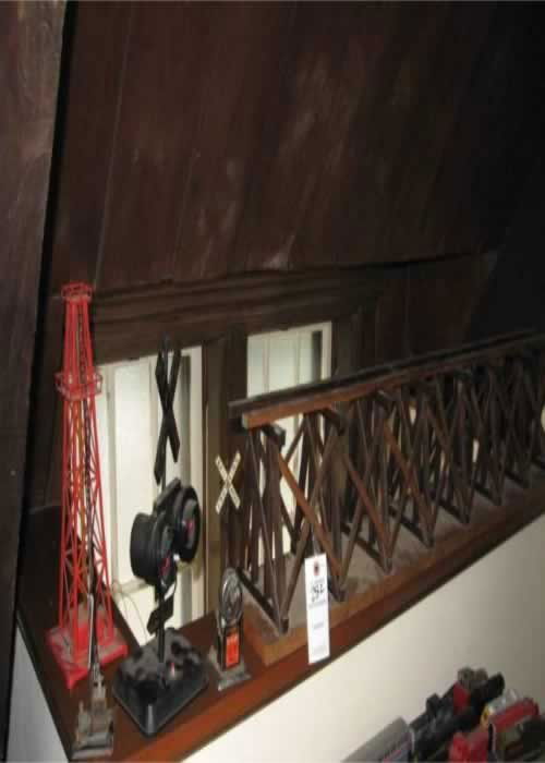 Early Crossing Signals: Collection of Early crossing signals includes (1) tin RR crossing gate, (1) tin RR crossing sign with bell, (1) plastic RR crossing sign with 110v lights & battery operated train sounds, (1) oil derri