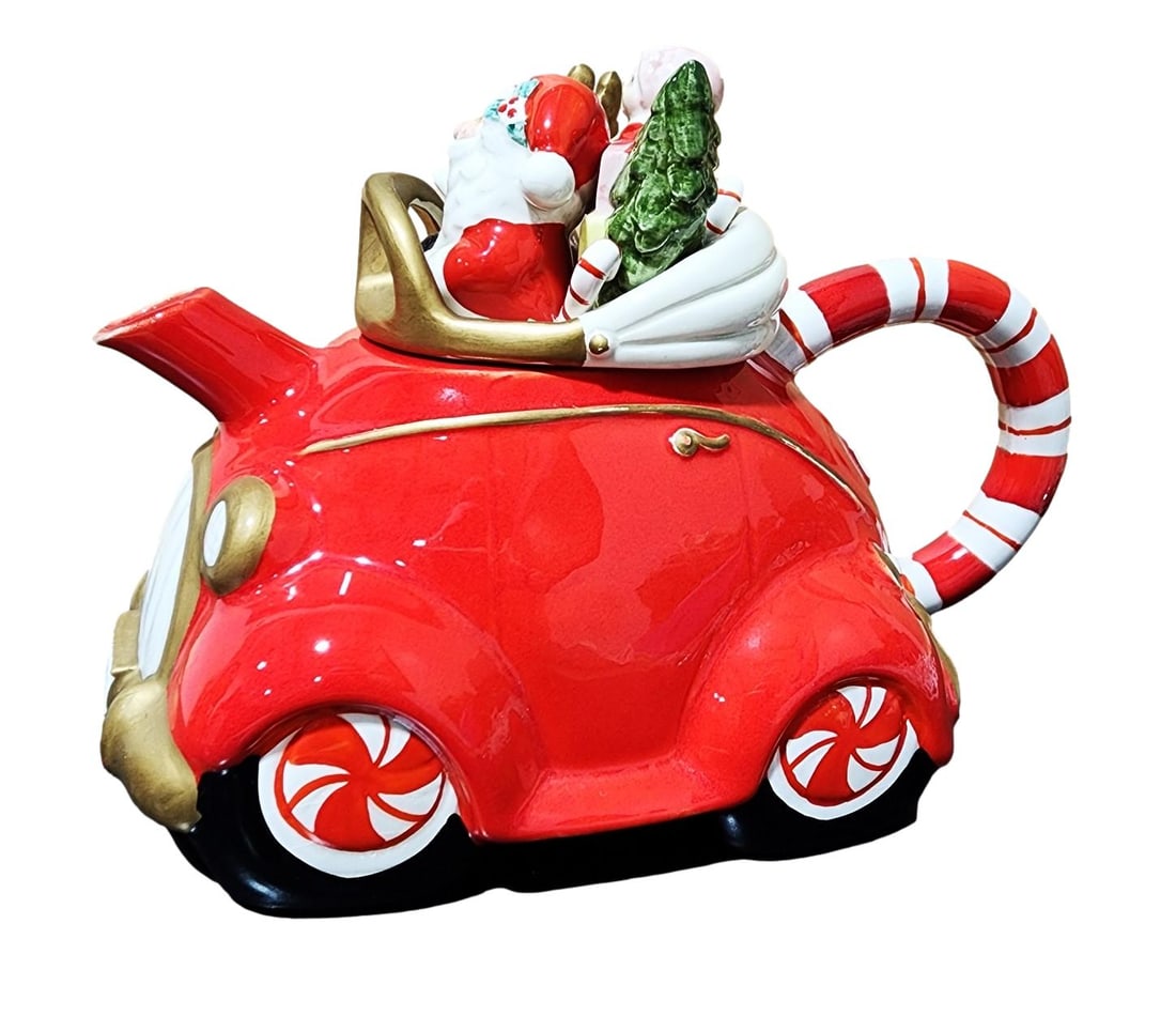 Santa and His Reindeer in a Red Car Teapot. By Fitz and Floyd. Circa 1980"s.: A Fitz and Floyd collectible Teapot featuring Santa Clause and a Reindeer Riding a a Red Car. The Original Price tag is still attached.