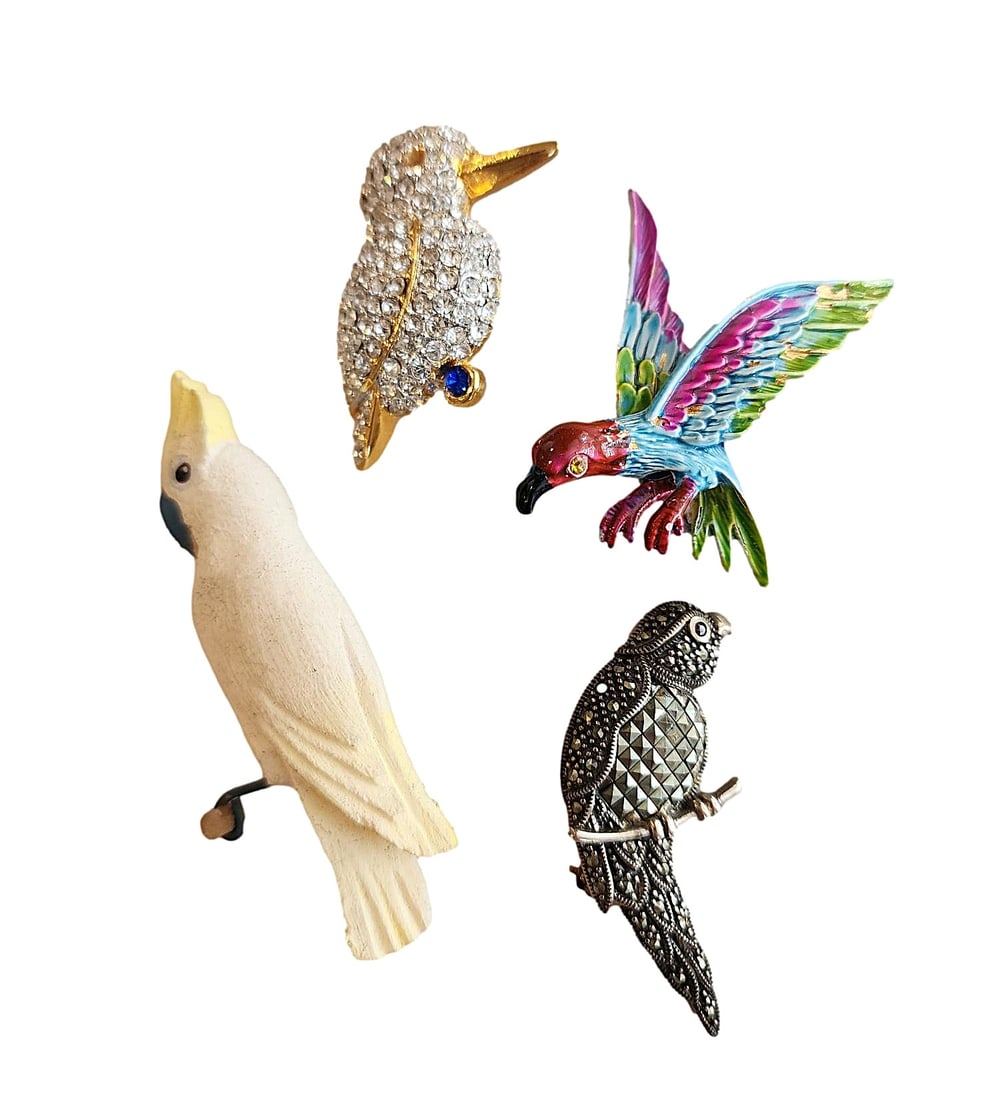 4 Parrot Themed Pins. One marked ART and one Sterling Silver: One is Wood, one has Marcasite Stones, one has crystals, and one appears to be hand-painted. Marcasite opin is stamped 925 and painted bird marked ART
