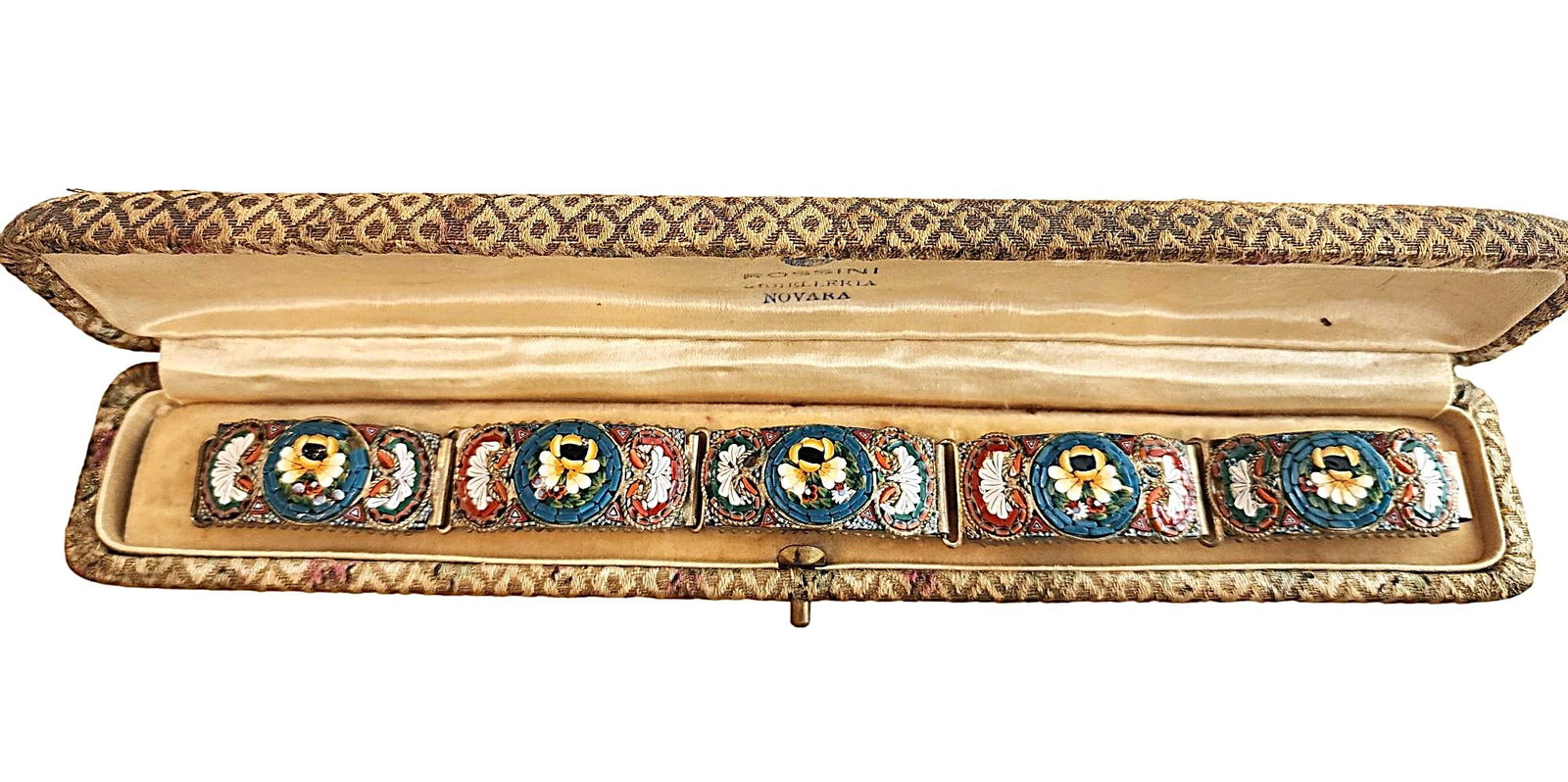 Vintage Bracelet with very decorative Floral Design. Unmarked: This Bracelet came to me in this Rossini Gioielleria Novara Bracelet Box, but I don't attribute this bracelet with Rossini. Maybe someone will have better luck than me tracking down the maker. I am le