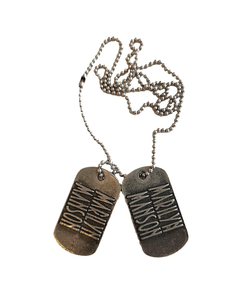 A Pair of Marilyn Manson Dog Tags on a 26" Chain. Made by: Alchemy 2004: 2 tags with 24" chain.