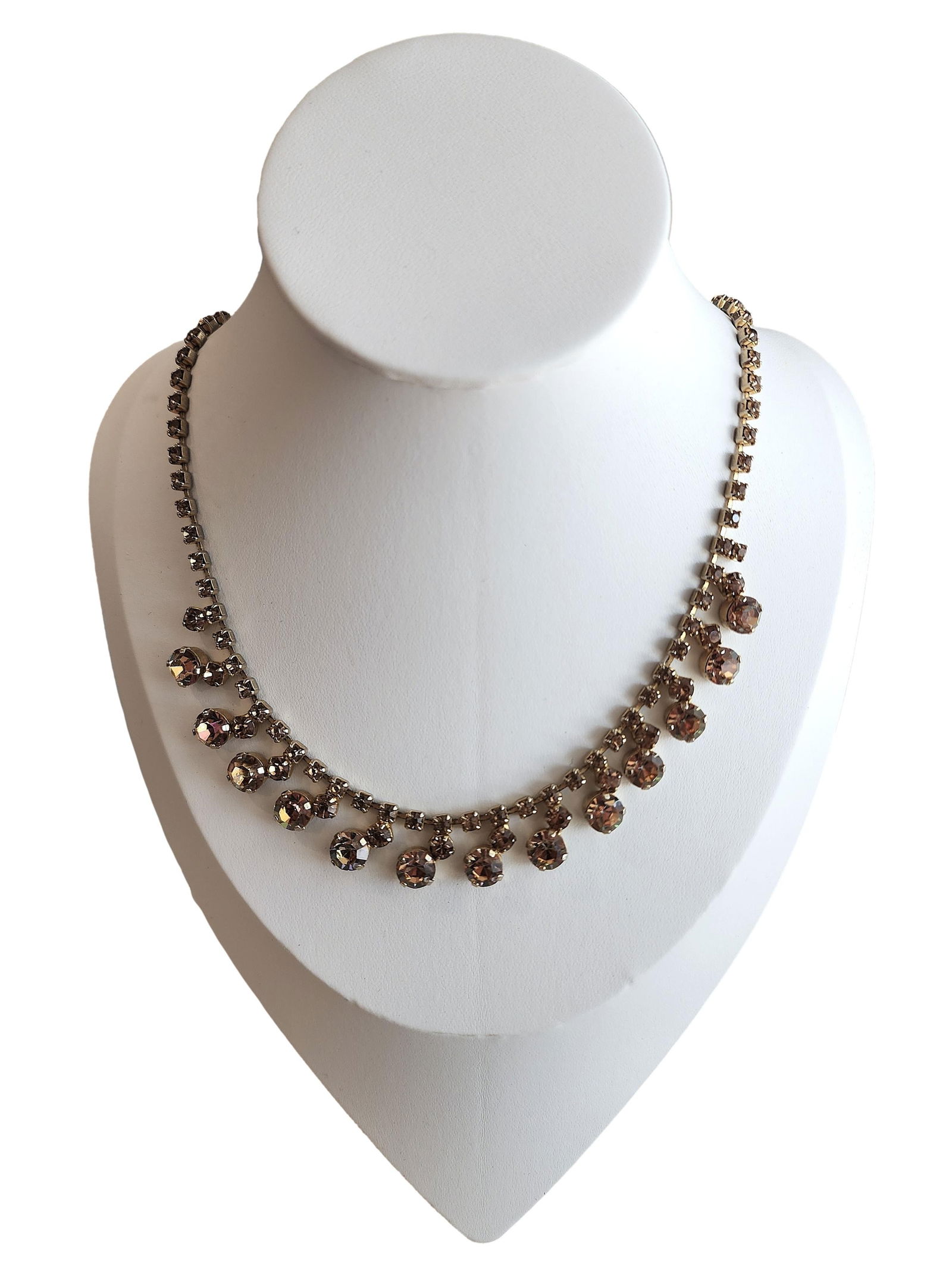 Vintage Rhinestone Necklace set in Gold Tone Metal with Pink/Peach Stones. Marked (Unable to read: 16". All Stones Present